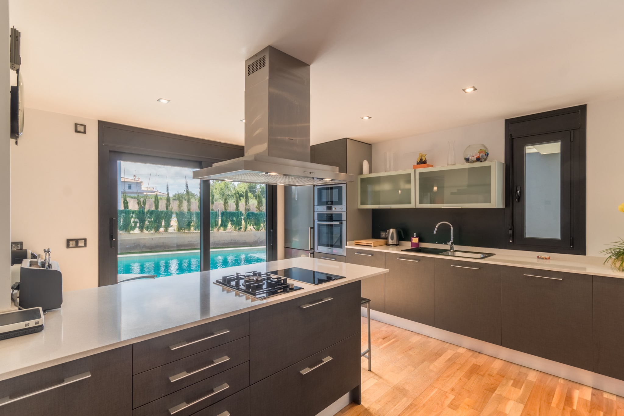 Living room(TV(satellite), dining table, fireplace, seating area, DVD player, radio), open kitchen(electric kettle, toaster, coffee machine, oven, microwave, dishwasher, fridge-freezer, Juicer, dishes and cutlery), bedroom(double bed), bedroom(double bed), bedroom(double bed), bathroom(shower), bathroom(shower), toilet(toilet), Internet access, Garden Furniture , TV, tumble dryer, solarium, washing machine, balcony, air conditioning, terrace, garden, sun loungers, BBQ, parking, swimming pool(private), iron, air to air heatpump, hairdryer