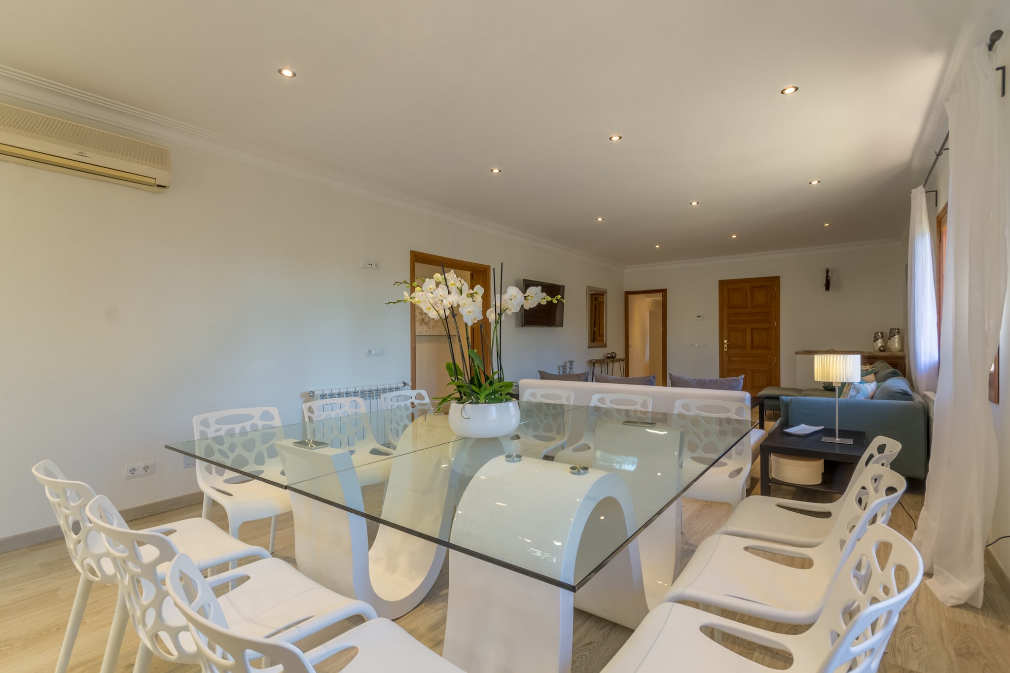 This spacious holiday house, Can Mesquida is a perfect getaway for large groups or families, accommodating up to 12 adults and babies. Featuring 6 double bedrooms and 7 bathrooms, including 3 en suites, the house is designed with comfort and convenience in mind. All rooms are equipped with air conditioning, heating, and TVs. The bright, open-plan living area offers ample space for relaxation with a large sofa, while the dining area and modern kitchen with top-of-the-line appliances provide a great setting for meals and gatherings. Free Wi-Fi ensures everyone stays connected during their stay.
Located just outside the town of Inca, the property is surrounded by a lush garden with palm trees and green space, offering a peaceful atmosphere. Inca, known as the “capital of leather,†is famous for its vibrant weekly market, held every Thursday, and its agricultural fair, "Dijous Bo." The city is well-connected by public transport, with easy access to the north coast of Mallorca. A short drive brings you to beautiful beaches such as Playas de Muro and Puerto Pollenca, known for their cleanliness and excellent services. Inca's charming cafes, restaurants, and bars are also within easy reach.
Outside, guests can enjoy a large garden with a 12m x 6m swimming pool, surrounded by sun loungers and umbrellas for ultimate relaxation. The property also features a well-equipped barbecue area, perfect for outdoor dining. For families with young children, the garden includes a playground with a slide and swing.
The Rental License number is ETV/10481