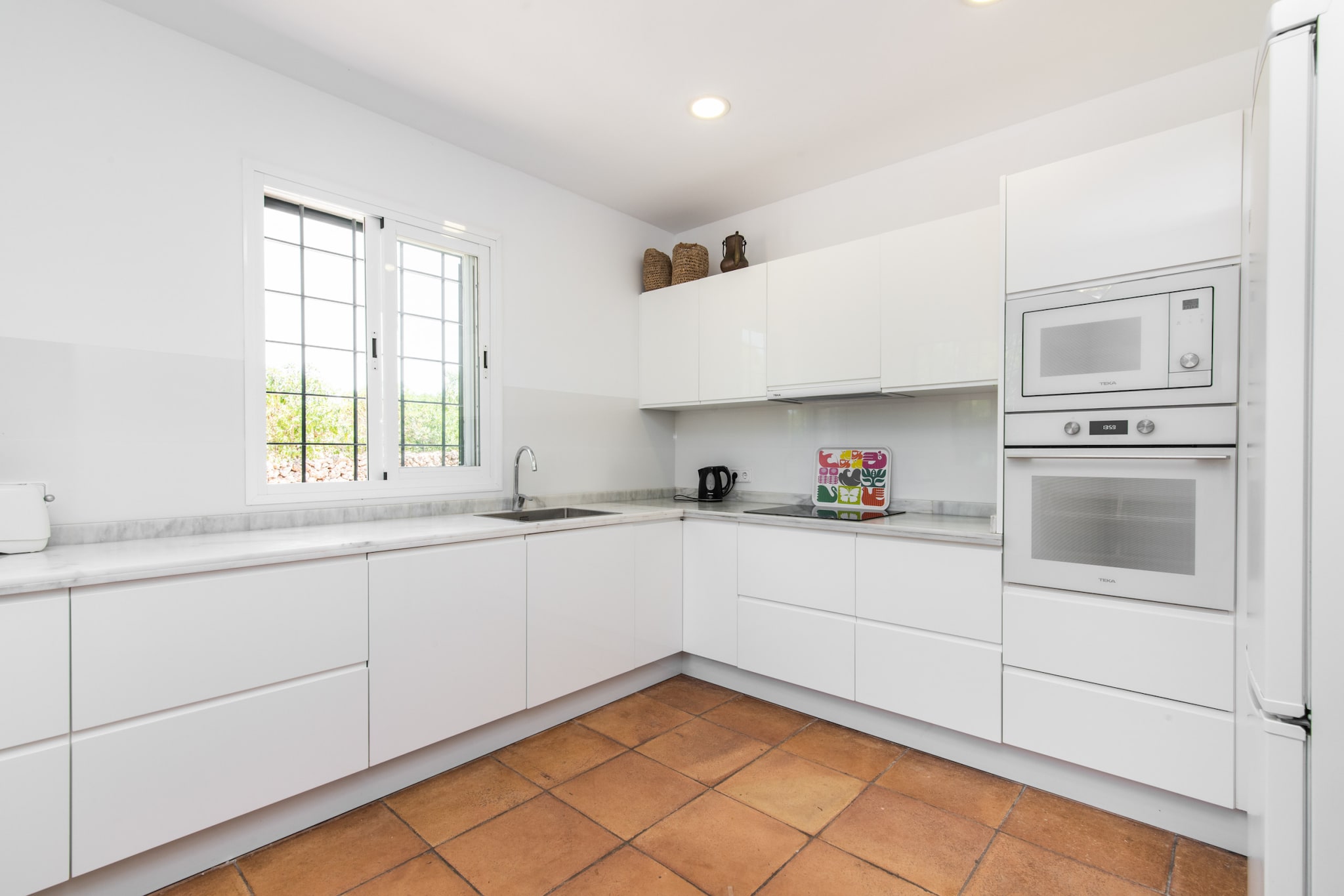 Ground floor: (Living room(double sofa bed, TV(flatscreen, satellite, digital), dining table, fireplace, seating area, DVD player, radio, stereo unit), open kitchen(stove(wood), electric kettle, toaster, coffee machine, oven, microwave, dishwasher, fridge-freezer, Juicer, dishes and cutlery), bedroom(double bed), bedroom(single bed, single bed), bedroom(single bed, single bed), bathroom(bath tub), bathroom(shower), bathroom(shower), toilet(toilet), Internet access)\n\nGarden Furniture , solarium, washing machine, heating(central), air conditioning, terrace, garden, sun loungers, BBQ, parking, swimming pool(private), iron, hairdryer, Extra pillows and blankets, Wine glasses