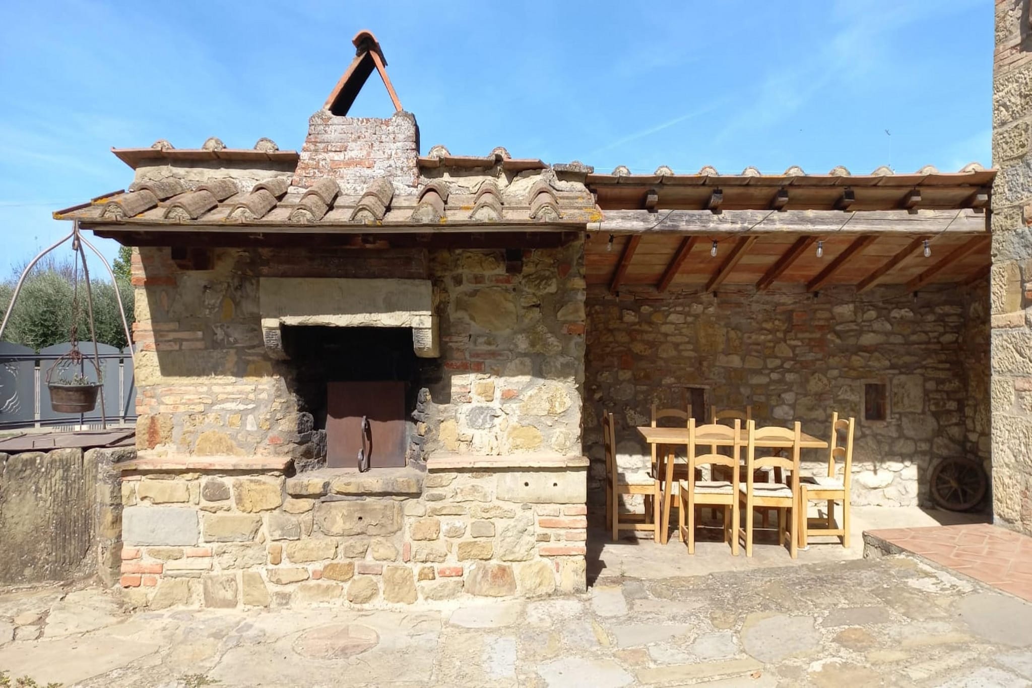 Casa Giglio is a charming Tuscan farmhouse dating back to the late 19th century, beautifully restored with traditional country furnishings and creative touches that blend rustic elegance with refined details. This spacious property is ideal for families or large groups, offering ample space for up to 14 guests.

The house consists of three fully equipped apartments, each featuring a flat-screen TV, Wi-Fi, a fully stocked kitchen, and a private outdoor seating area, ensuring comfort and convenience throughout your stay. Located just 2.4 km from the historic center of Castiglion Fiorentino, it is easily accessible to shops, dining, and other essential services, with the nearest supermarket only 1.2 km away. 

This place comes with a decorative fireplace that is strictly non-operational. The lighting of fires within the apartment is expressly prohibited.

The farmhouse boasts a stunning, fully fenced outdoor area, perfect for relaxation and recreation. The huge pool with a sun terrace is exclusively for guests, along with dedicated children's play areas, a BBQ, and peaceful nooks to unwind. Enjoy fresh produce from the farm, including oil, wine, jam, vegetables, and eggs. For those who like to cook, the garden is a true treat, while the welcoming owners, Sara and Roberto, provide a personal touch, offering guidance or help when needed.

The pool operates from 1 June to 15 September, depending on weather conditions, especially during rainy periods. Please note that the fireplace is decorative only and cannot be used. The ground floor includes two bathrooms, as it consists of two independent apartments, each with its own bathroom. A dishwasher is not available on-site.

With its blend of comfort, privacy, and heartfelt hospitality, this farmhouse promises a memorable Tuscan escape where families can connect, relax, and create lasting memories together.