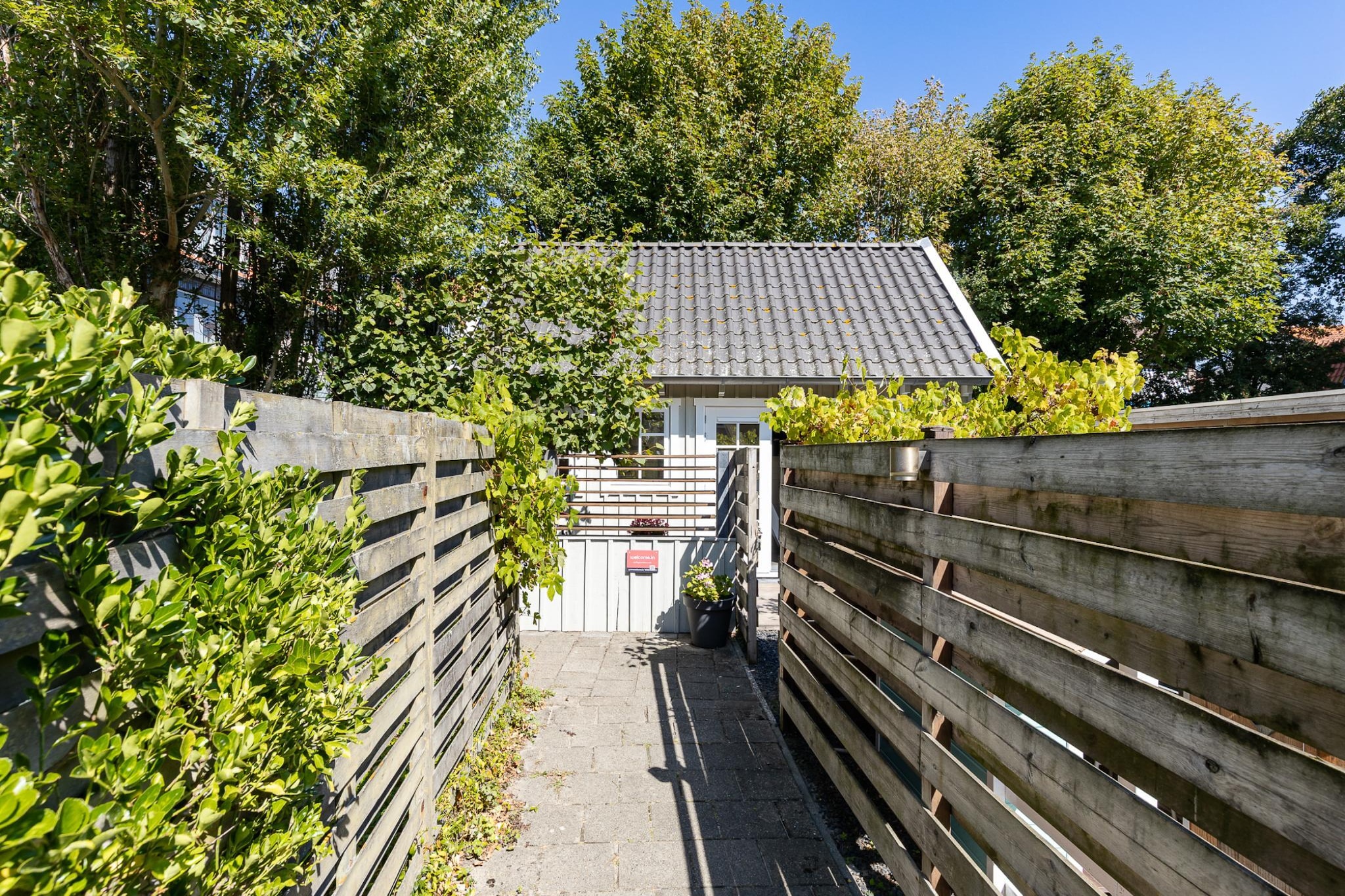 Lijsterhofstraat 13 - Knusse vakantiewoning nabij strand en centrum-Außenbereich Sommer