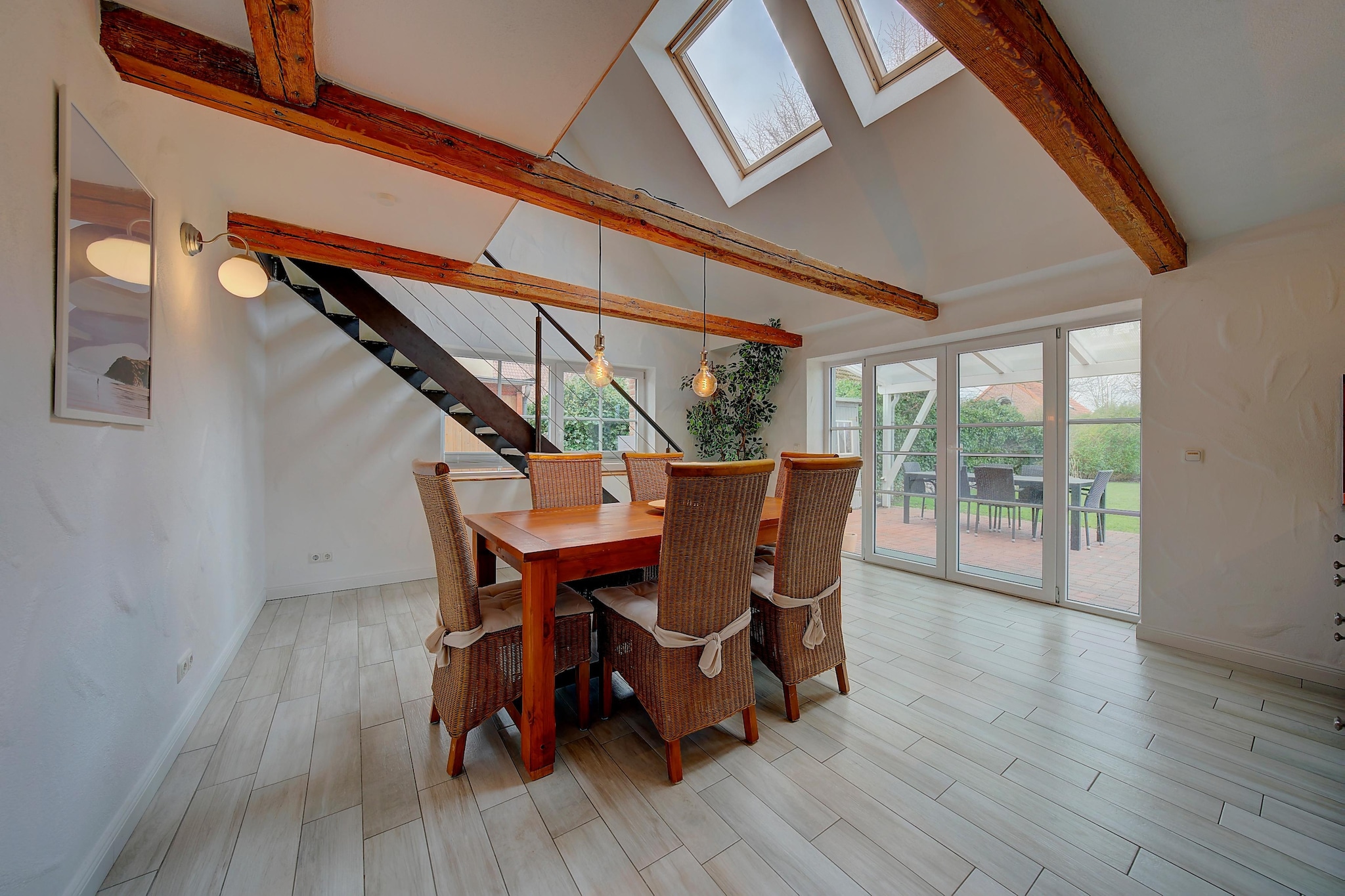 Ground floor: (open kitchen(dining table(6 persons), electric kettle, toaster, cooker(4 ring stoves, gas), coffee machine, microwave, dishwasher, fridge(+ freezer)), bedroom(double bed), bedroom(double bed), bathroom(shower(walk-in shower), washbasin, toilet), bathroom(bath tub, washbasin, toilet), bathroom(shower(walk-in shower), washbasin, toilet, washing machine), Landing)\n\nOn the 1st floor: (Living room(double sofa bed, TV))\n\nheating, terrace, garden, garden furniture, BBQ(gas), parking, parking, high chair, baby crib(free), Towels/Sheets (extra fee)