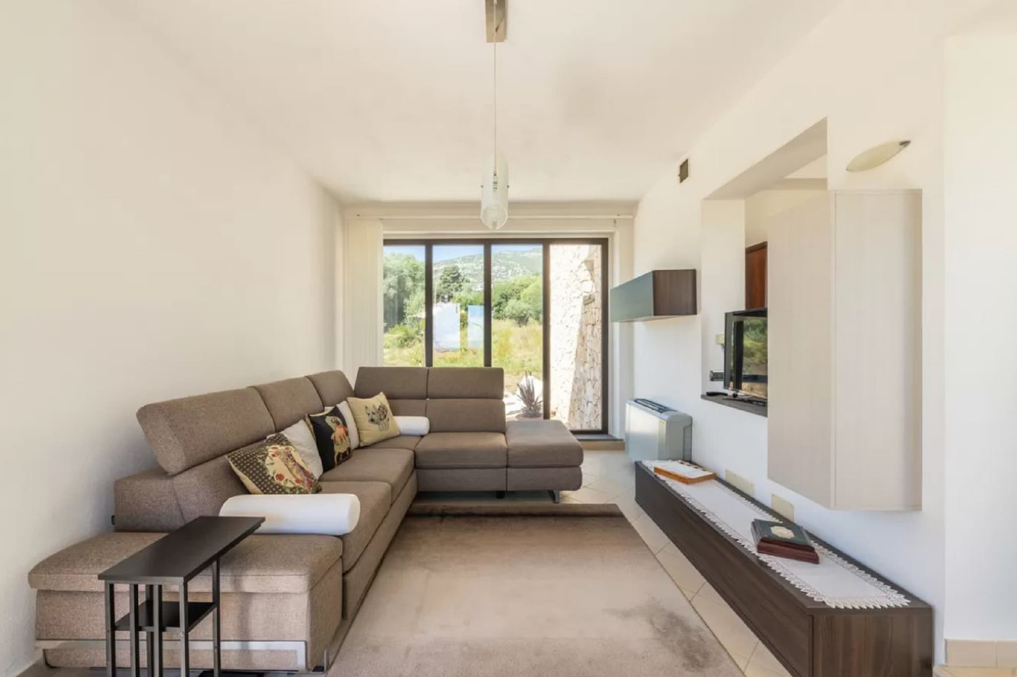 Set in the scenic countryside just 2.5 km from the center of Orosei and 5 km from the sea, this charming holiday home for 6 guests offers the perfect blend of comfort and nature. With free WiFi, private outdoor spaces, and air conditioning, itâ€™s ideal for a relaxing getaway with family or friends.

The single-level layout features a cozy living room with a TV and seating area, a separate dining room with a fireplace, and a fully equipped kitchen including a hob, fridge-freezer, and dishwasher. There are three bedrooms: one with two single beds, another with a small double bed, and a master bedroom with an en-suite bathroom. An additional bathroom and a washing machine add to the homeâ€™s practicality.

Outside, enjoy your private garden with sun loungers, a terrace, barbecue, and dining area, perfect for alfresco meals or sunset relaxation. Private parking is available on-site. With beaches and Orosei just minutes away, this home is an ideal base for exploring the beauty of Sardinia.