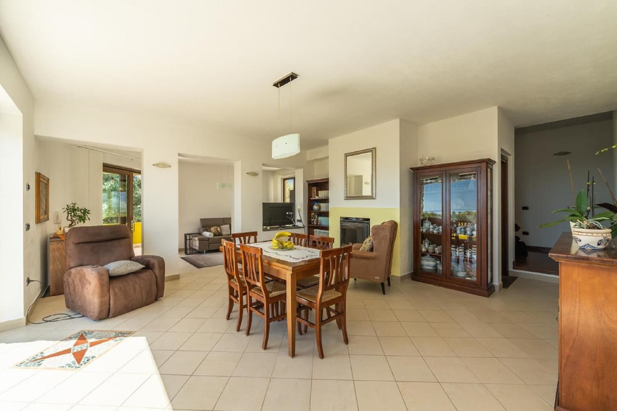 Ground floor: (Living room(TV, seating area), dining room(dining table, fireplace), Kitchen(hob, dishwasher, fridge-freezer), bedroom(single bed, single bed), bedroom(small double bed), Bedroom with bathroom(double bed, shower, washbasin, toilet, bidet), bathroom(shower, washbasin, toilet, bidet), washing machine, air conditioning)\n\nterrace(private), garden(private), garden furniture, sun loungers, BBQ, parking