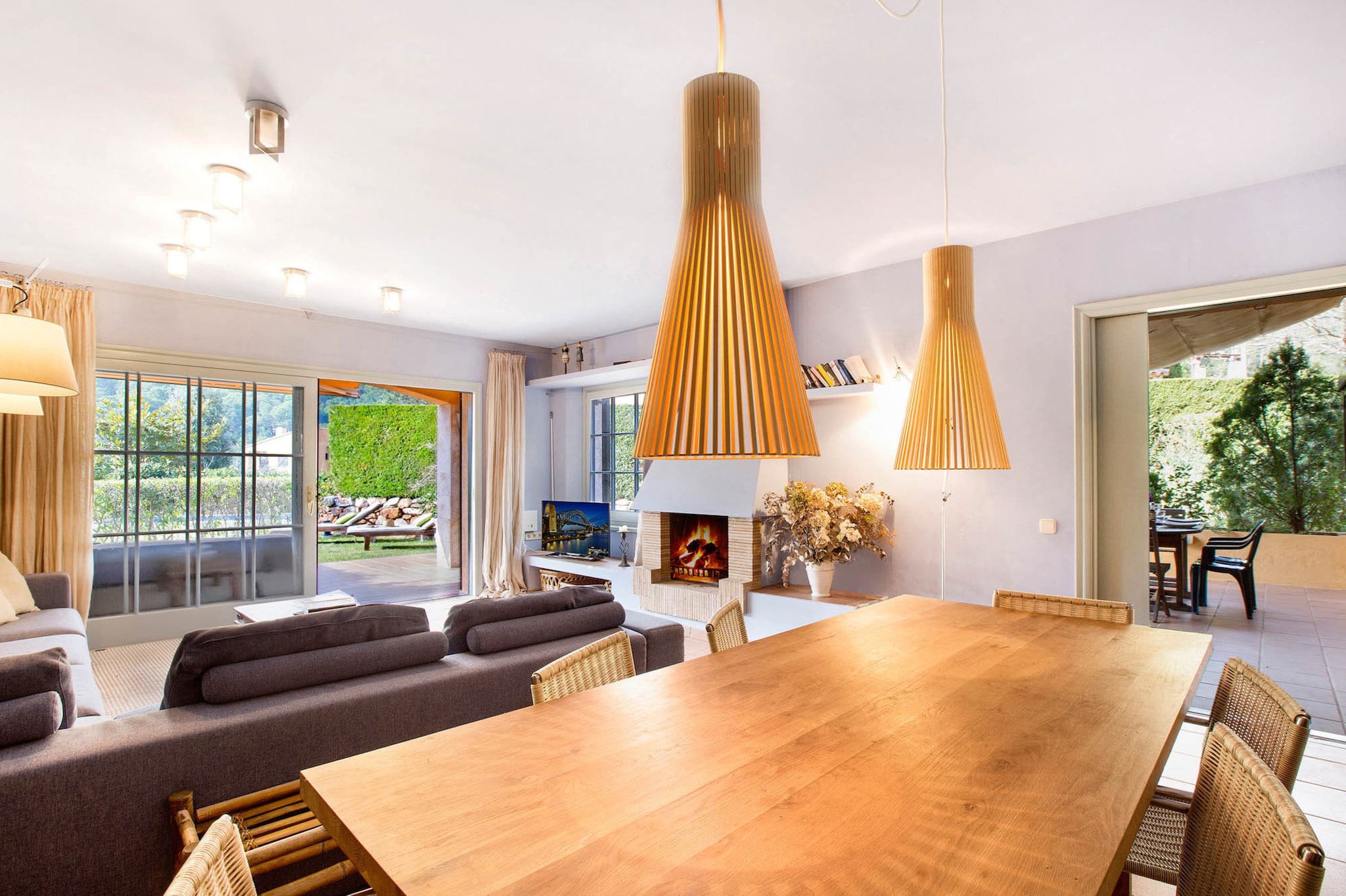 This spacious villa in Llafranc offers a comfortable stay with five bedrooms, accommodating up to nine guests within its 202 mÂ² layout. Nestled in a family-friendly area, it provides a welcoming atmosphere for a relaxing getaway. The property features a lush garden, outdoor furniture, and a terrace, perfect for enjoying the fresh air. A communal swimming pool offers a refreshing retreat, while a barbecue setup is ideal for outdoor dining. Additional conveniences include a washing machine, iron, Wi-Fi, and a TV for entertainment. Pets are not allowed, ensuring a peaceful environment for all guests.  

Situated just 450 meters from the sandy beach, the villa allows easy access to the stunning coastline. The nearby city center offers a variety of restaurants, cafÃ©s, and local shops, providing plenty of dining and shopping options. A supermarket within walking distance ensures access to daily essentials. Golf enthusiasts can visit a scenic course 20 km away, making for an enjoyable day trip. The areaâ€™s vibrant yet tranquil ambiance makes it ideal for both relaxation and exploration.  

The independent kitchen is well-equipped with modern appliances, including a refrigerator, microwave, oven, and freezer. A dishwasher ensures easy cleanup, while dishes, cutlery, a coffee machine, and a toaster add extra convenience. The washroom is well-maintained, offering a clean and comfortable space to refresh.