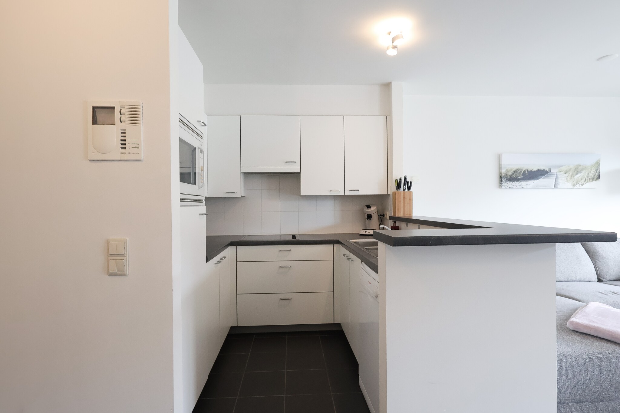 This modern two-bedroom apartment offers a stylish and comfortable stay in the heart of Oostduinkerke. Designed for up to four guests, it features a cozy living space with a welcoming atmosphere. The sleeping arrangements include a double bed and a unique four-person bunk bed, making it ideal for families or small groups. A private terrace or balcony provides a lovely outdoor space to relax. The apartment is completely smoke-free and does not allow pets. Entertainment options include a flat-screen TV, digital television, and Google Chromecast, while electric heating ensures a pleasant stay in any season.  

Located in the bustling center, this apartment offers easy access to a variety of shops, restaurants, and cafÃ©s. Enjoy fresh seafood at local eateries or grab a coffee at one of the charming cafÃ©s nearby. The vibrant markets offer a taste of regional delicacies, while boutique stores provide a unique shopping experience. For outdoor lovers, scenic walking trails and cycling paths are just moments away, making it easy to explore the coastal beauty of Oostduinkerke.  

Designed with convenience in mind, the apartment features a fully equipped kitchen with a dishwasher, microwave, combi microwave, fridge with freezer compartment, and both a coffee maker and a Senseo machine. The modern bathroom includes a bath with a shower screen, sink, and toilet. Situated on the second floor, the apartment is easily accessible and provides a welcoming retreat in a prime location.