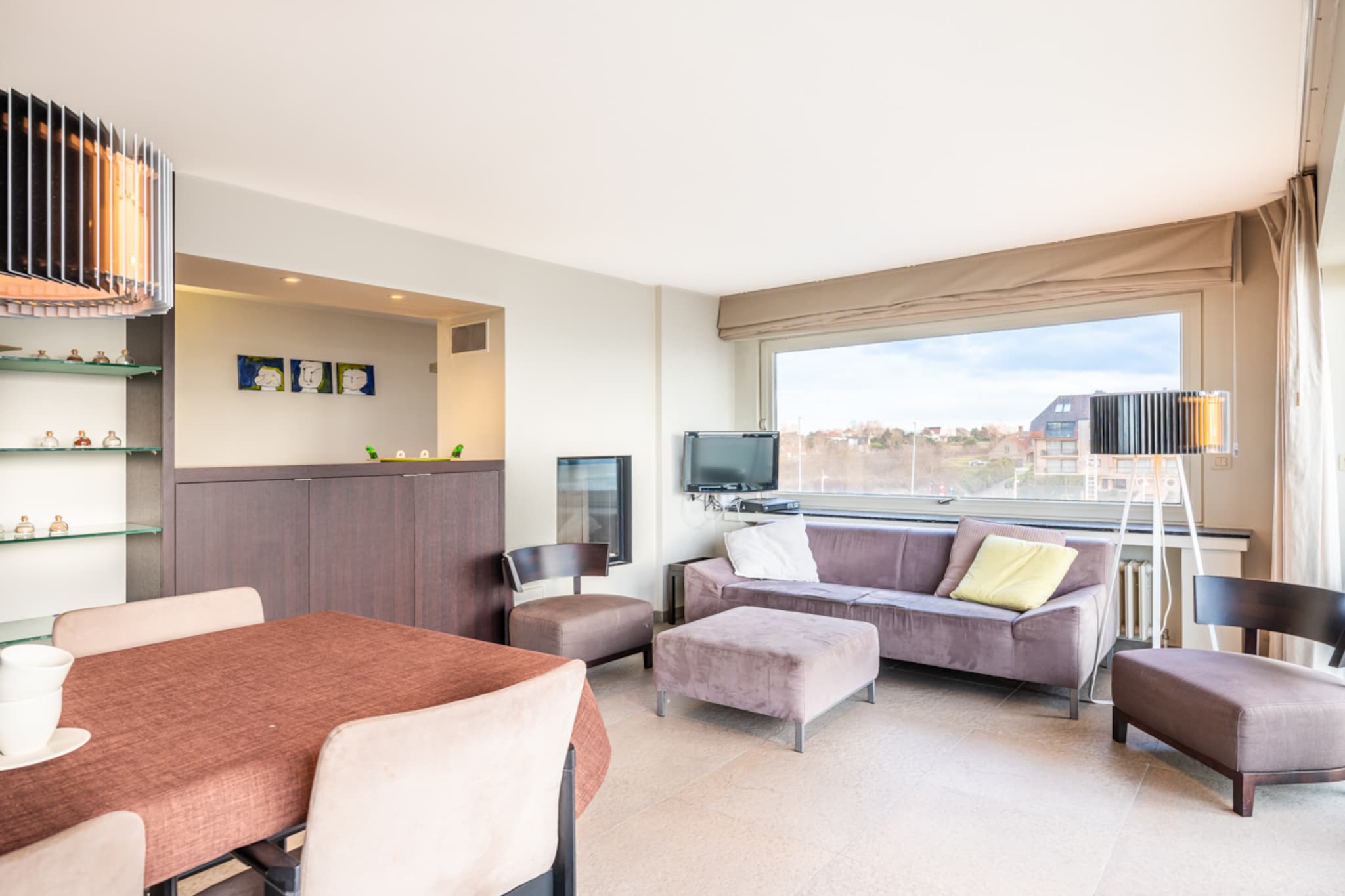 This charming apartment offers a stunning frontal sea view and a cozy atmosphere for up to five guests. The sunny living room features a fireplace, perfect for relaxing after a day at the beach. Two balconies provide breathtaking ocean views, while the comfortable sleeping arrangements include a single box spring bed and two double box spring beds. The apartment is entirely smoke-free and does not allow pets. Stay entertained with a flat-screen TV, digital television, and WiFi. Heating is provided by natural gas, ensuring comfort year-round.  

Situated in the heart of Oostduinkerke, this apartment is ideal for a family getaway. Enjoy easy access to the sandy beaches, where children can play and adults can relax. Just steps away, you'll find charming cafÃ©s, excellent seafood restaurants, and a variety of shops, including a toy store and trendy boutiques. The area also offers scenic coastal walking trails and cultural attractions, making it a perfect destination for relaxation and exploration.  

For added convenience, the apartment includes a fully equipped kitchen with a combi microwave/oven, a fridge with a freezer compartment, a dishwasher, and a coffee maker. The modern bathroom features a shower, two sinks, and a toilet. Located on the second floor, the apartment is easily accessible via a lift. A private garage box under the seawall ensures secure parking during your stay.