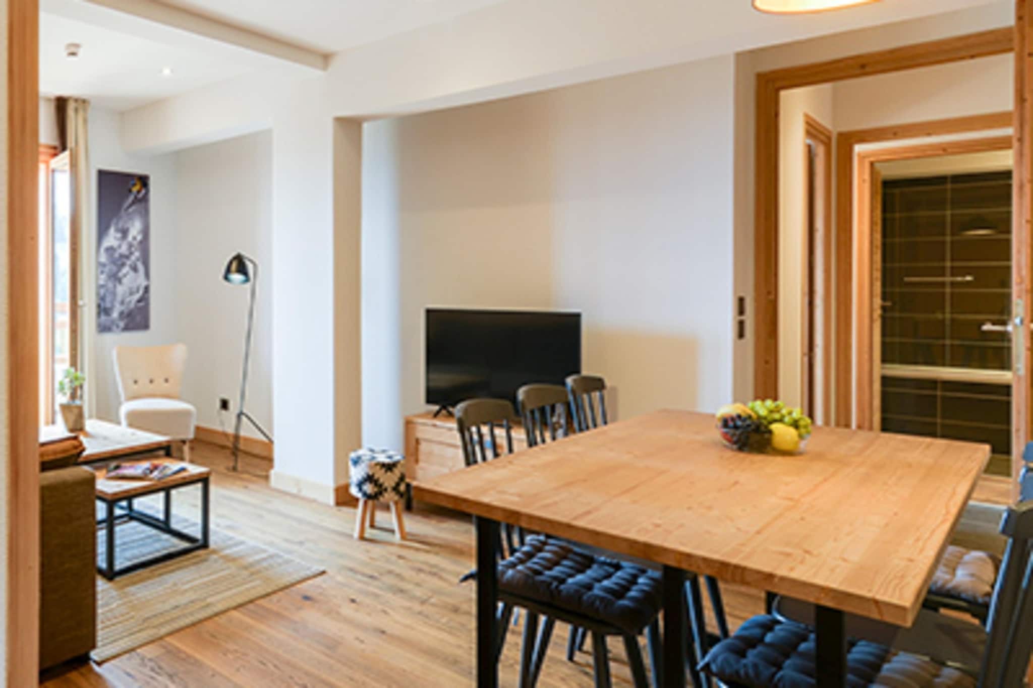 Step into a world of alpine comfort in this expansive retreat, where the beauty of the mountains meets the warmth of a true family home. Designed to welcome large groups with ease, the space feels both grand and intimate. You will find three restful bedrooms—a master with a large double bed and two additional rooms featuring twin beds—plus a cozy double sofa bed in the living area. The heart of the home is a sunlit living space where a flat-screen satellite TV invites you to relax after a day of exploration. For the younger guests, a dedicated playroom offers a space of their own, while adults can find total serenity in the private sauna or the heated indoor swimming pool shared within the grounds.

The open kitchen is a bright, social hub that makes holiday cooking a joy. Whether you are brewing a fresh pot of coffee to enjoy on your private balcony or using the ceramic hob and oven to prepare a feast, every convenience—including a dishwasher and microwave—is at your fingertips. The dining area is perfect for long, laughter-filled dinners where you can plan tomorrow's hike or ski adventure. To ensure the youngest travelers are just as comfortable, a cot and high chair are ready for use. Every corner of this pet-friendly residence is touched with a sense of ease, from the air-conditioned rooms to the convenience of on-site parking and high-speed internet.

Beyond the front door, the authentic charm of the local area is just a short walk away. You can wander through local markets and cafes or hop on a bus just 800 meters from the property to explore the wider region.