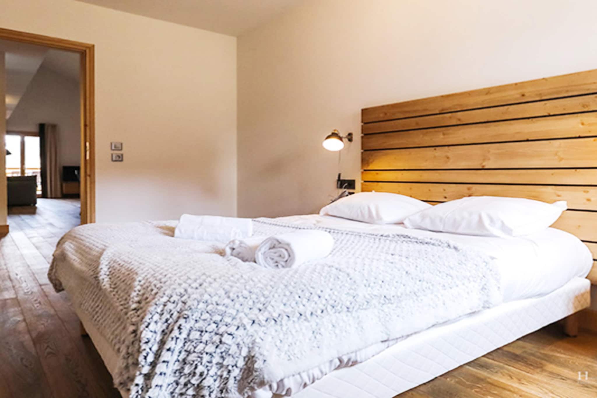 Imagine waking up to the silent majesty of the Alps, where the iconic peaks of Mont-Blanc frame your morning coffee. This expansive retreat offers a warm sanctuary for up to eight guests, designed to feel both grand and intimate. The home features three well-appointed bedrooms—a master with a large double bed and two additional rooms with twin beds—plus a comfortable double sofa bed in the living area. The heart of the home is a sunlit living space where a flat-screen satellite TV invites you to relax after a day on the slopes. For a touch of true luxury, you can find total serenity in your private sauna or take a refreshing dip in the heated indoor swimming pool shared within the residence.
The open kitchen is a social hub that makes holiday cooking effortless. Whether you are brewing a fresh pot of coffee to enjoy on the balcony or using the ceramic hob and oven to prepare a feast, every convenience—including a dishwasher and microwave—is at your fingertips. With three modern bathrooms, each featuring its own shower and toilet, the morning rush is a thing of the past, giving your group more time to enjoy the crisp mountain air. To ensure the smallest travelers are comfortable, a cot and high chair are ready for use. Every corner of this residence is touched with ease, from the stunning mountain views to the convenience of on-site parking and high-speed internet.
Beyond the front door, the authentic charm of Combloux is yours to explore. In winter, you are perfectly positioned near two massive ski areas, offering family-friendly slopes and pristine snow. Summer transforms the landscape into a lush haven for hiking and exploring the nearby biotope lake.