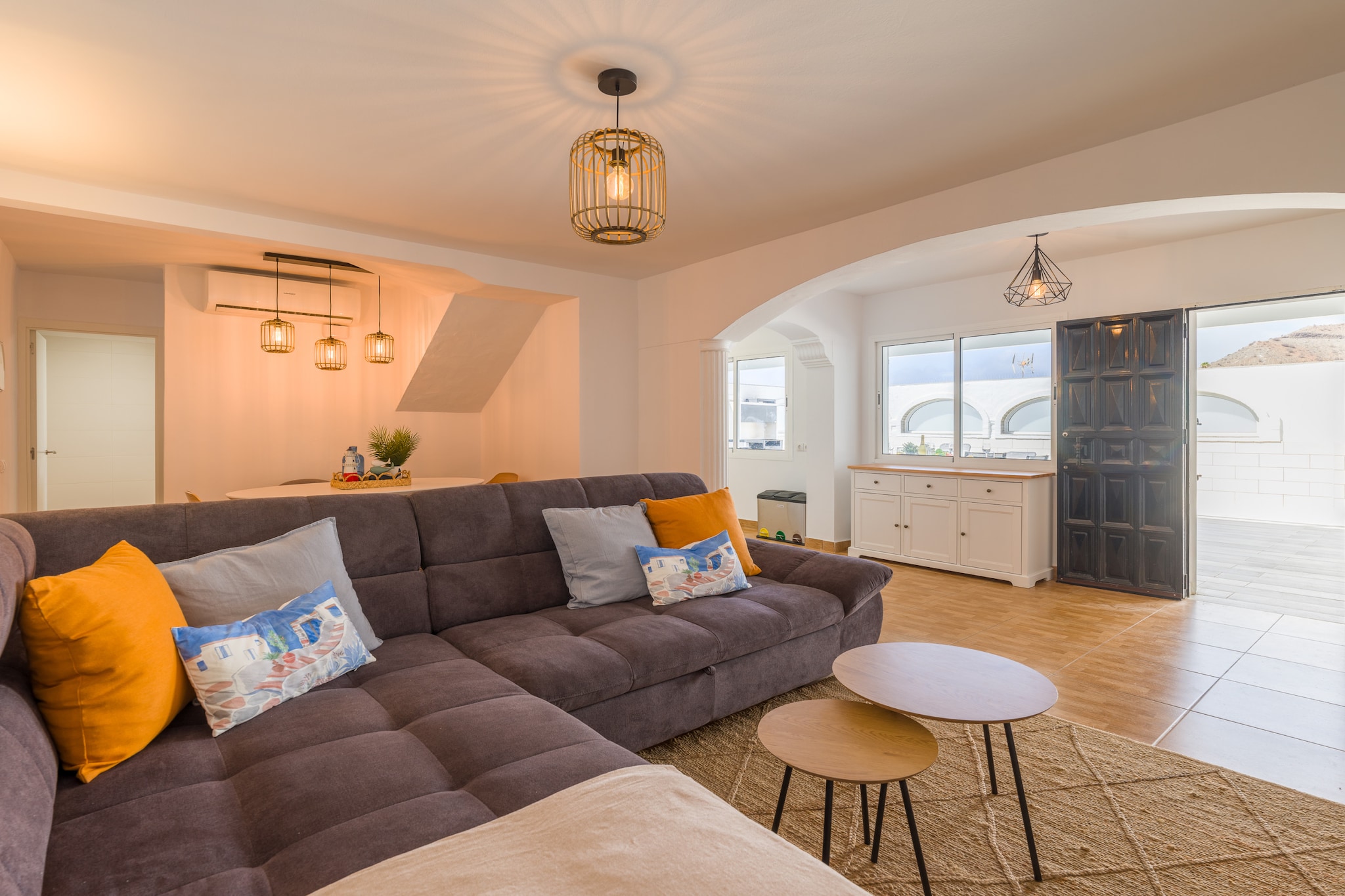 Welcome to your dream retreat, where breathtaking sunsets illuminate a stunning beachfront location! Situated within a modern residential complex just steps from Anfi del Mar, this exceptional accommodation features not only two communal pools but also the pristine sandy shores just minutes away. With two spacious terraces, including a delightful barbecue area for alfresco dining, it's the perfect spot to soak up the sun, savor your morning coffee, or share laughter under the stars.

As you step inside, you'll be greeted by a harmonious blend of Mediterranean charm and contemporary comfort. Warm tones and charming wood and ceramic details create a serene coastal ambiance throughout the space. The main floor is designed for relaxation and entertainment, featuring a fully equipped kitchen with modern appliances, including a dishwasher for effortless meal prep. Unwind in the airy living room, equipped with air conditioning and a 55â€ TV that offers international programming, plus a sofa bed for additional guests. The spacious terrace invites you to gather around the dining table for six and enjoy leisurely moments in the chill-out area. 

Just 600 meters away, vibrant restaurants, supermarkets, and local attractions await you. Enjoy unlimited high-speed WiFi (300 Mbps), weekly cleaning for longer stays, and complimentary amenities like a cot and highchair for little ones upon request. Please respect our residential environment and adhere to designated quiet hours to ensure a peaceful experience for all.