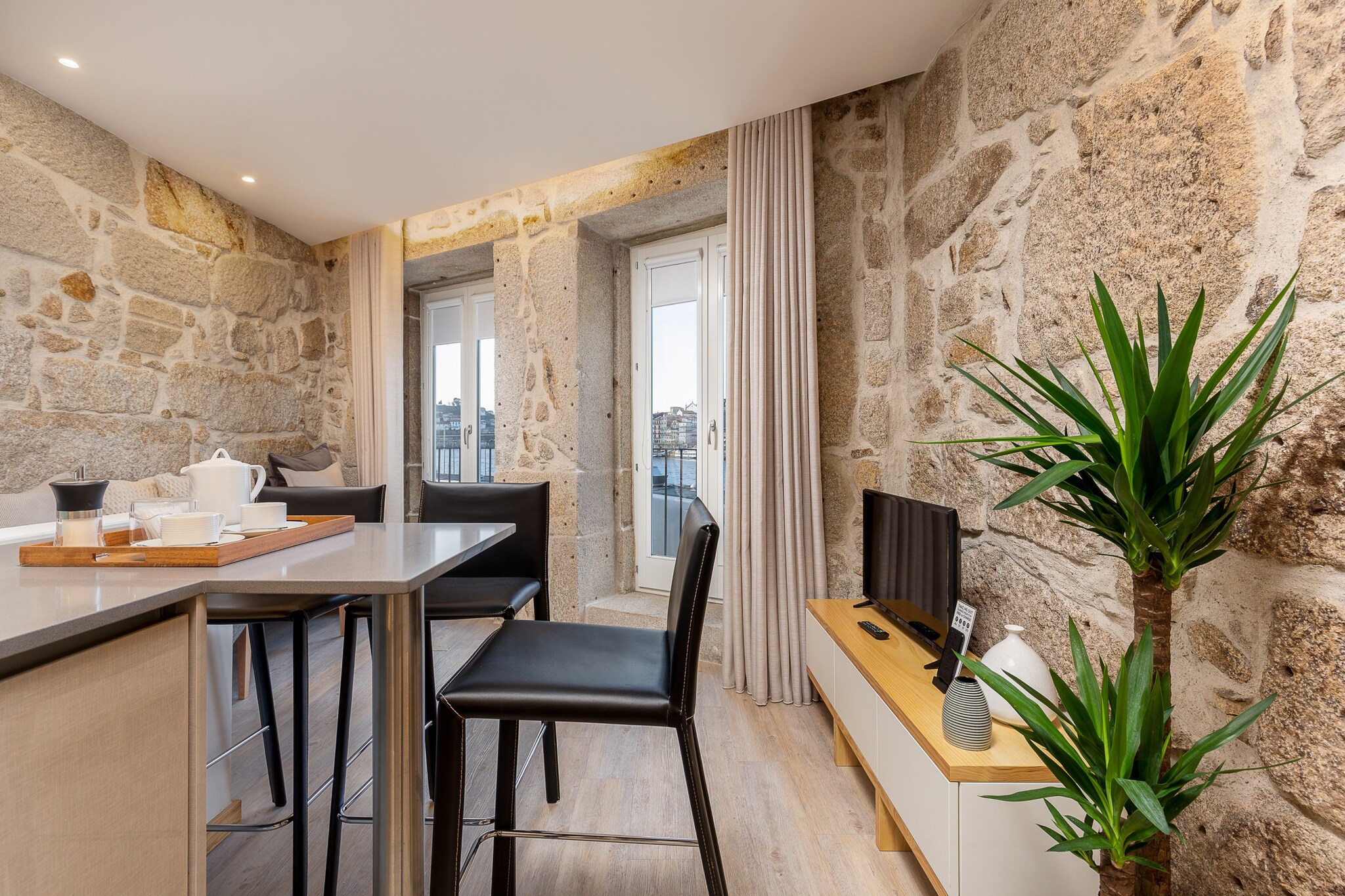 This property, along with its cozy and well-equipped features, is perfect for a comfortable stay. It offers one bedroom with two bedsâ€”one double and one singleâ€”ideal for up to three guests. Additional amenities include air conditioning, Wi-Fi, and a TV with multiple language channels. A balcony provides a scenic view of the river, while a fully furnished living room includes a sofa for relaxation. Guests can also enjoy easy access to essential items such as towels and linens during their stay. 

Located in the vibrant city of Vila Nova de Gaia, this apartment offers convenient access to local attractions. Just 750 meters from the General Torres train and metro station, it ensures easy travel options. The bustling city center, Ribeira market, and the picturesque Ribeira de Gaia are all within walking distance, providing a perfect base to explore the area. Whether you're looking to enjoy local cafÃ©s, markets, or historic landmarks, everything you need is within reach.

The apartment features a fully equipped kitchen with essential appliances, including a refrigerator, freezer, microwave, coffee machine, and cooking utensils, making it ideal for preparing meals during your stay. The modern bathroom comes with a shower for added comfort. With its combination of practical amenities and a central location, this property guarantees a seamless and enjoyable stay.