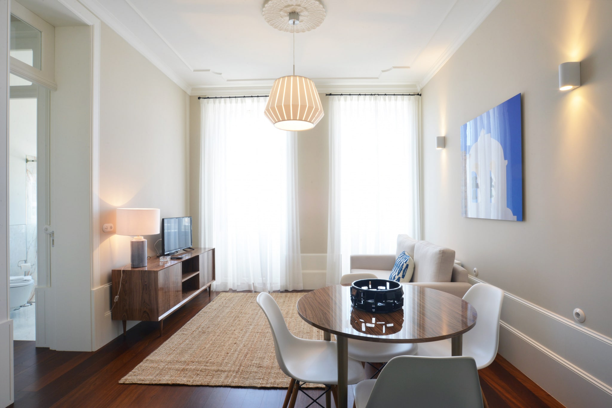 This apartment, along with its modern design and thoughtful layout, offers an ideal retreat for up to four guests. Featuring two cozy bedrooms with double beds, the space ensures a restful stay. A comfortable sofa is included in the living room, while a private balcony adds an extra touch of relaxation. With essential amenities like Wi-Fi, air conditioning, and a flat-screen TV, this apartment ensures a convenient and pleasant stay. Additional rentals such as baby high chairs and cots are available, making it suitable for families.
Located in the heart of the vibrant city, the apartment offers easy access to local cafes, shops, and popular tourist attractions. A supermarket is just 500 meters away, while the nearest metro and train station are about 1100 meters from the property, allowing guests to easily explore the city. Iconic landmarks, cultural spots, and delightful eateries can all be reached within a short walk, making this apartment a prime location for both leisure and business travelers.
The apartment has a fully functional kitchen, providing guests with everything needed to prepare meals at their convenience. The kitchen includes modern appliances such as a refrigerator, coffee maker, microwave, and oven. The bathroom features a shower and all necessary toiletries, enhancing your overall comfort. With a fully equipped space and convenient access to the city, this apartment offers a complete and enjoyable stay.