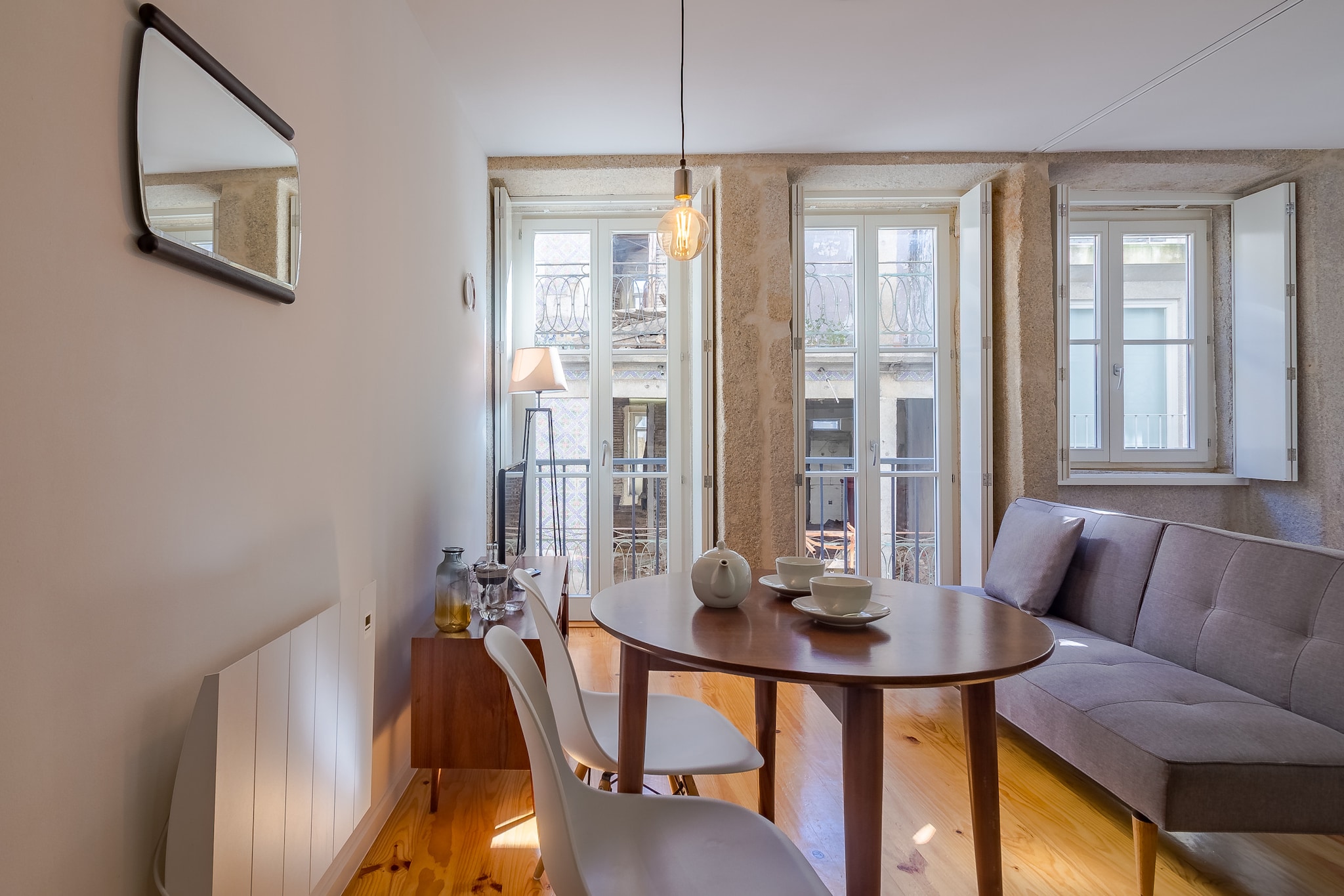 This property, along with its cozy ambiance, is an ideal option for couples or solo travelers. The apartment features a comfortable double bed, offering space for up to two guests. It is not pet-friendly, ensuring a serene atmosphere for those seeking peace and privacy. The unit includes a spacious living area with a sofa, perfect for unwinding after a day of exploration. Guests can enjoy the fresh air on the balcony, which offers views of the surrounding area. With air conditioning and Wi-Fi, the apartment ensures a pleasant and connected stay. Additionally, the property provides access to cable TV with various international channels, catering to diverse preferences.

Located in the heart of Porto, the apartment is just steps away from the city's main attractions, such as the historic Ribeira district and the iconic Dom LuÃ­s I Bridge. Guests can easily explore nearby cafes, restaurants, and vibrant markets, offering a taste of local culture and cuisine. Public transportation is readily accessible, with bus and metro stations close by. For those arriving by air, Porto's Francisco SÃ¡ Carneiro Airport is a short drive away, ensuring convenience for travelers.

The apartment is fully equipped to meet your needs during your stay, featuring an independent kitchen with a refrigerator, stove, microwave, and cooking utensils. The private bathroom with a shower ensures comfort and convenience, while the thoughtful inclusion of Wi-Fi and cable TV adds a touch of relaxation. Whether preparing meals or simply enjoying downtime in the apartment, all amenities are designed for a hassle-free stay.