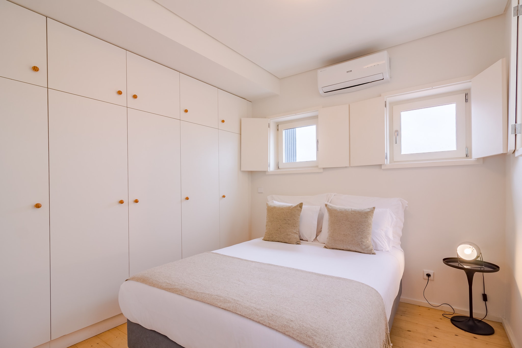 Living room(TV(satellite), dining table, seating area), open kitchen(electric kettle, toaster, coffee machine, oven, microwave, fridge-freezer, dishes and cutlery), bedroom(double bed), bedroom(single bed, single bed), bathroom(shower, hairdryer), Internet access, heating(electric), air conditioning, iron