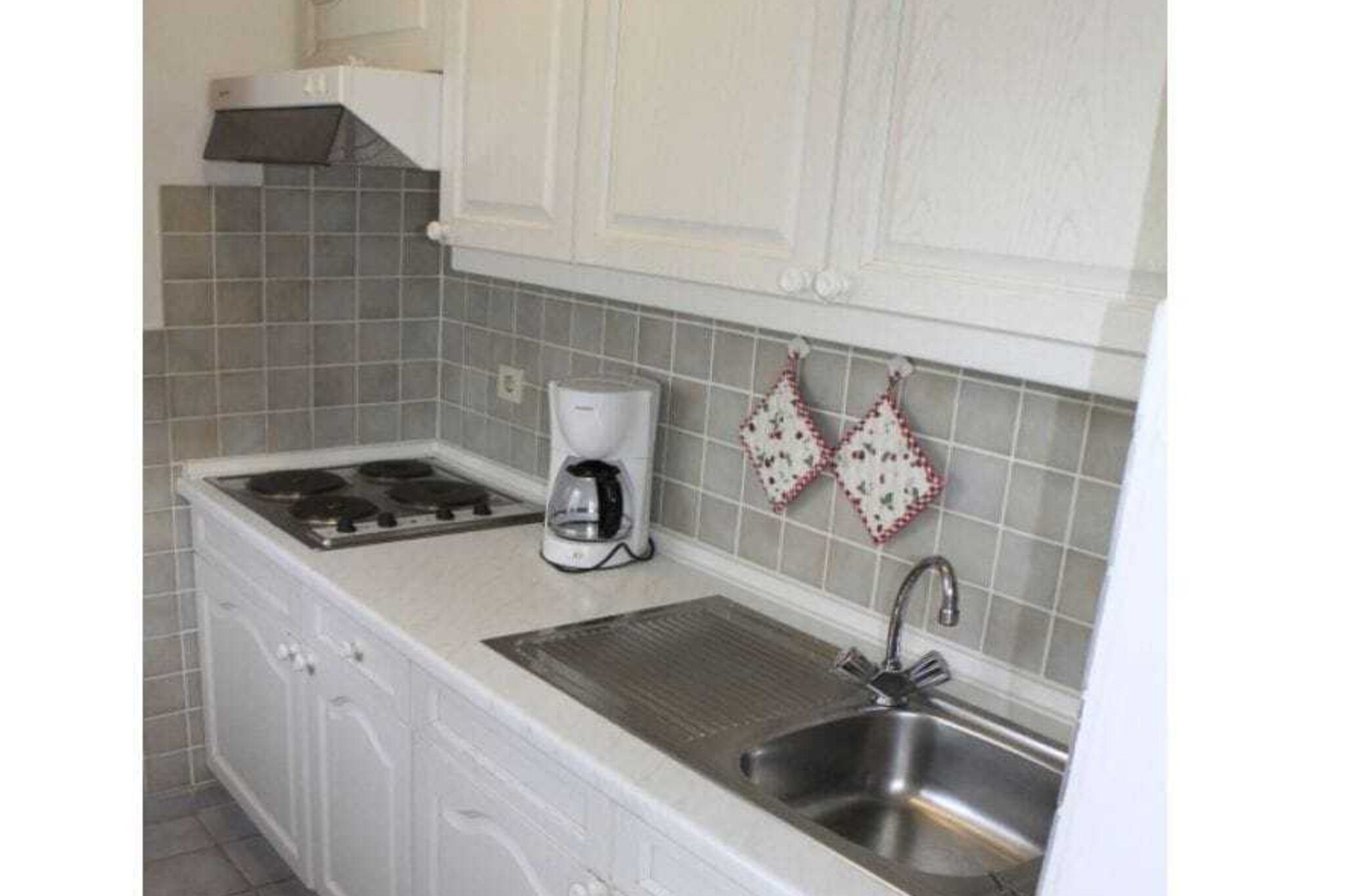 Ground floor: (Living/bed room(Armchair, Bed Linen, Sofa, Wardrobe, single bed, double bed, TV, TV, dining table, radio))\n\nHot Water, Vacuum Cleaner, Kitchen(Egg Cooker, Tea Towels, Kitchenette, stove, electric kettle, toaster, cooker, coffee machine, fridge, freezer), bedroom(Bed Linen, Wardrobe, single bed, radio), bathroom(Mirror, toilet, shower, washbasin), terrace(Sun Umbrella, garden furniture), terrace(Sun Umbrella, garden furniture), parking, ironing board, iron, drying cabinet, Laundry Package for a fee