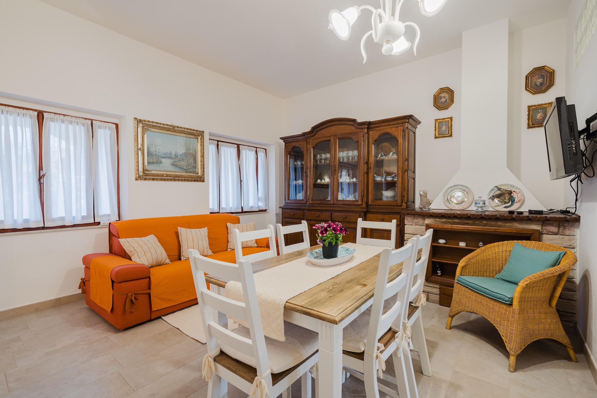 Discover the perfect retreat at this charming holiday home in Lu Bagnu, ideal for families or friends looking for comfort and relaxation. On the ground floor, youâ€™ll find a cozy living room featuring a TV, a dining table, a warm fireplace, and a comfortable seating area, making it the perfect spot to unwind. The open kitchen is equipped with a hob, hood, oven, and a fridge-freezer, ensuring you have everything you need to prepare your favorite meals.

This home includes two well-appointed bedrooms: a restful bedroom with a double bed and a second bedroom with two single beds, ideal for children or additional guests. The modern bathroom features a shower, toilet, bidet, and a convenient washing machine for your laundry needs. Outside, relax on the terrace, complete with garden furniture, where you can enjoy meals al fresco and soak up the sun. Parking is also available for your convenience.

Located in Lu Bagnu, this holiday home provides easy access to nearby attractions. Explore the picturesque beaches of the area, such as Lu Bagnu Beach and Spiaggia di Margherita di Pula, known for their golden sands and clear waters, perfect for sunbathing and swimming. The charming town offers delightful local restaurants and cafÃ©s where you can savor Sardinian cuisine. For nature lovers, nearby attractions include the scenic Capo Sorisso and Castelsardo, a historic town featuring a medieval castle and stunning coastal views. This holiday home is an excellent base for an unforgettable vacation in Sardinia.