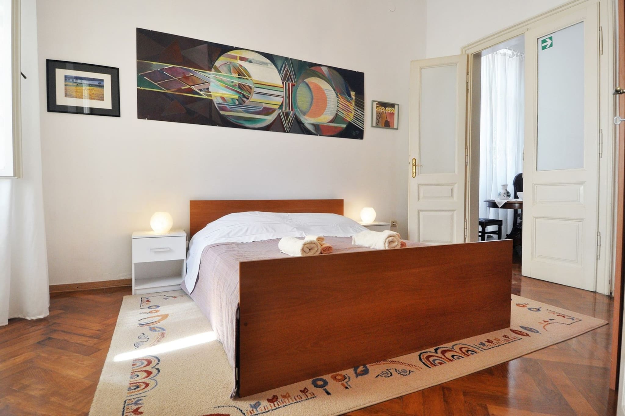 On the 1st floor: (Kitchen(hob, electric kettle, toaster, coffee machine, oven, microwave, dishwasher, fridge, freezer, dishes and cutlery), Living/diningroom(double sofa bed, TV, dining table, seating area), bedroom(double bed), bedroom(single bed, single bed), bathroom(shower, toilet, bidet), bathroom(shower, toilet, bidet), Internet access)\n\nwashing machine, balcony, patio, air conditioning, ironing board, iron, hairdryer, hot water, Essentials