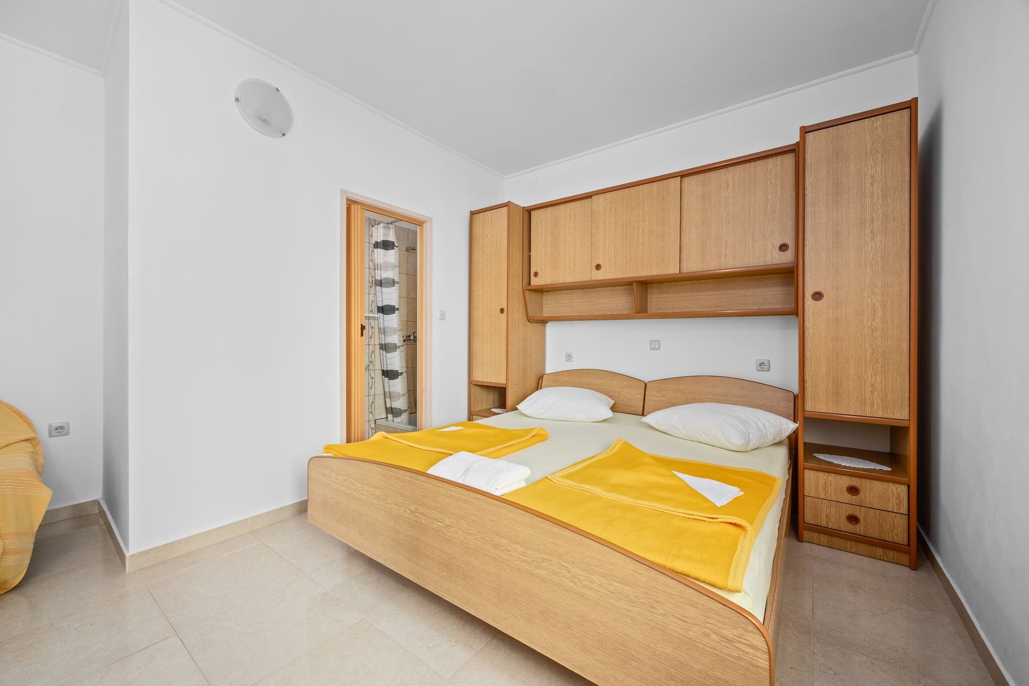 Nestled in the peaceful village of Barbat on Rab Island, this charming ground-floor apartment is perfect for couples or small families. It features a spacious kitchen with dining area, a cozy bedroom with a double bed, and a bathroom with a shower. The private terrace offers stunning sea views, ideal for morning coffee or sunset relaxation.

Designed for two adults and one child, the apartment includes essentials for longer stays. Guests share a lush garden with a barbecue area and a large yard. A private dock with free boat mooring is available, and a small boat can be rented with prior notice and a valid license.

Just 500 meters from the beach and close to Rabâ€™s historic sites, local restaurants, and scenic trails, this apartment is a great base for exploring the island. Free parking, Wi-Fi, and a tranquil setting make it a perfect retreat for those seeking both comfort and adventure.