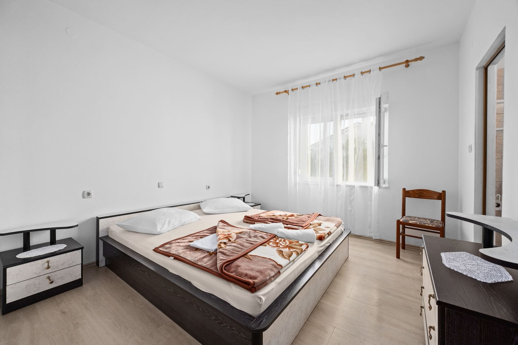 This charming apartment offers a cozy retreat for up to three guests, featuring a queen-size bed and a spacious sofa in the living area. Step out onto your private balcony to enjoy morning coffee or unwind in the evening breeze. The apartment includes air conditioning, Wi-Fi, and satellite TV, with optional laundry service available for added convenience.

The fully equipped kitchen includes a fridge, stove, microwave, coffee machine, and all the essentials for home-cooked meals. The modern bathroom features a shower, hair dryer, and complimentary toiletries, plus a washing machine for longer stays.

Located near scenic beaches and historic landmarks, the apartment is just 500 meters from a supermarket and within walking distance of restaurants and cafÃ©s. Public transport is easily accessible, with a bus stop only 300 meters away. Whether you're here to relax or explore, this non-smoking, pet-free apartment offers the perfect blend of comfort and location.