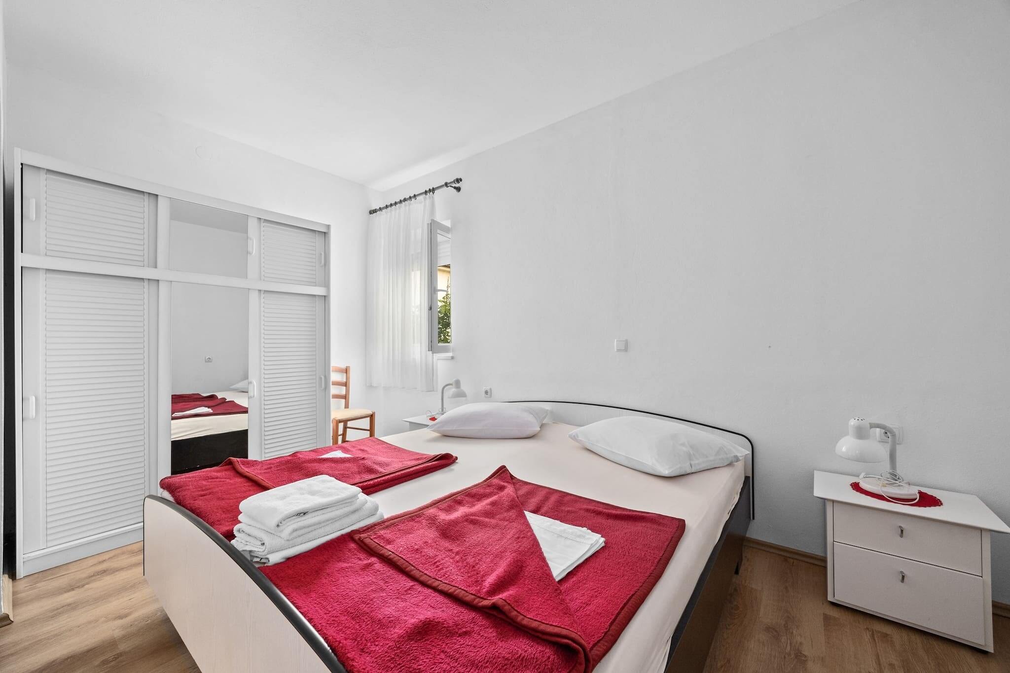 Enjoy a peaceful stay in this well-appointed two-bedroom apartment in Barbat, Rab, perfect for families or small groups of up to five guests. It features two queen-size beds and a single sofa bed, along with air conditioning, Wi-Fi, and satellite TV. A spacious private balcony offers stunning sea views, ideal for morning coffee or sunset relaxation.

The apartment includes a fully equipped kitchen with a stove, fridge, microwave, and coffee machine, plus a bathroom with a shower, hair dryer, and toiletries. A washing machine is available on request for longer stays. Free private parking is provided, and laundry service can be arranged.

Just 500 meters from a sandy beach, the apartment is close to local attractions like the ruins of St. Damianâ€™s fortress and the charming Old Town Rab. Guests can also rent a small boat (license required) to explore nearby islands. With its tranquil setting and convenient amenities, this non-smoking, pet-free apartment is a perfect coastal retreat.