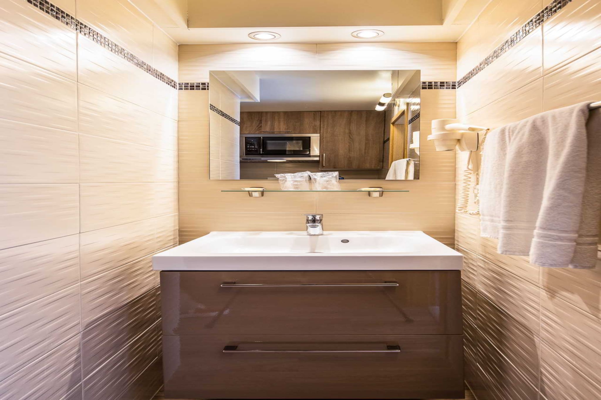 On the 3rd floor: (Living room(double sofa bed, TV(flatscreen)), Kitchen(dining table, hob, electric kettle, coffee machine, combination microwave, fridge, electric hot plates, dishes and cutlery, Cooking basics, Wine glasses), bedroom(single bed, single bed, TV), bathroom(toilet, hairdryer, shampoo, body soap, hot water))\n\nbathroom(shower, toilet)