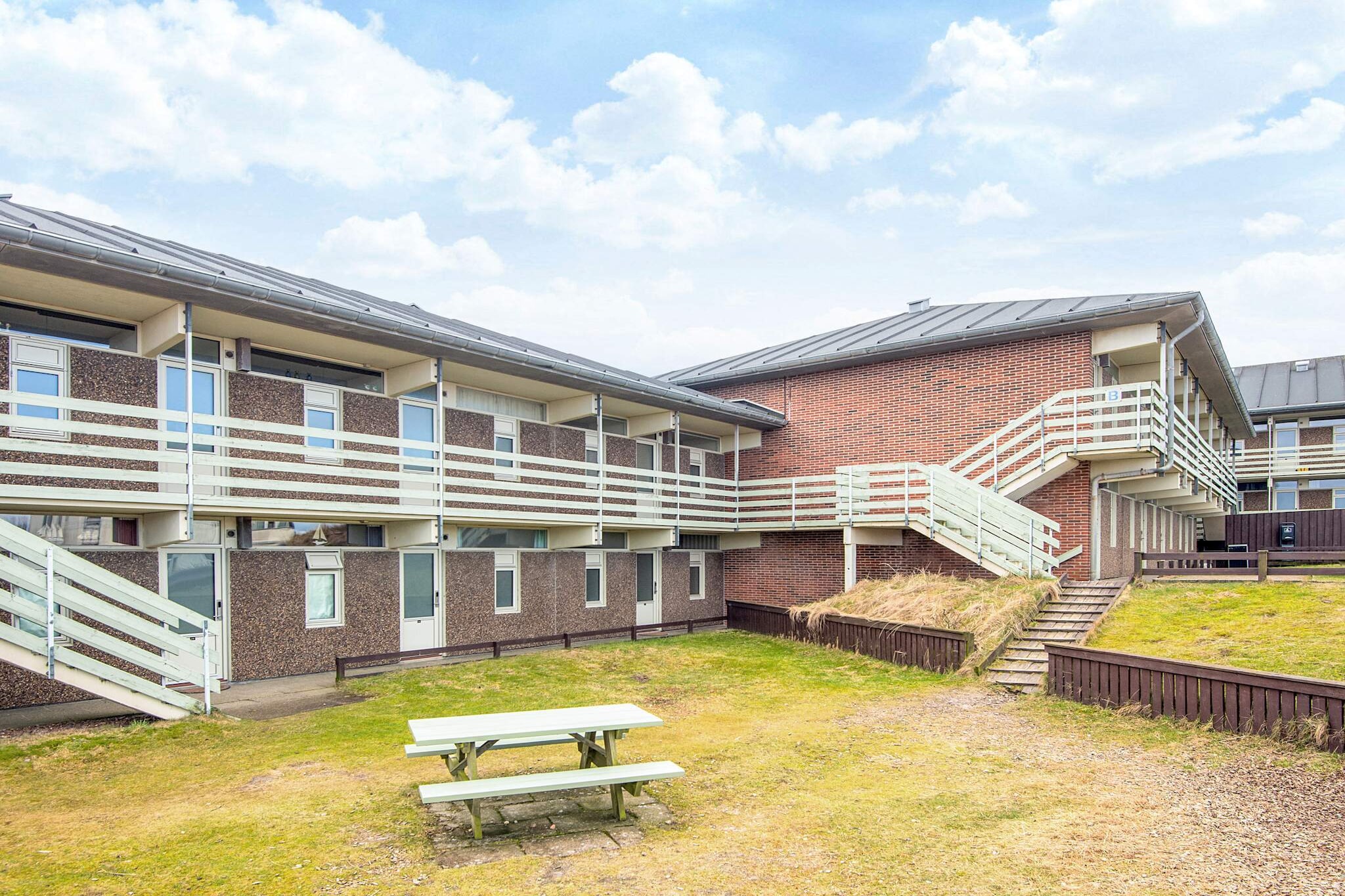 Enjoy a relaxing beachside stay in this superbly renovated ground-floor apartment, perfectly located in scenic Fanø—just 20 metres from the shoreline. Situated in Feriecenter Vesterhavet, this bright and modern holiday apartment offers direct access to the dunes and a terrace where you can watch the sun set over the North Sea. 
Fully renovated in 2024, the apartment features a clean, beach-hotel vibe with fresh walls, stylish new furniture, and a practical kitchen. The living room provides a cozy space for relaxing and spending time together, while the two well-furnished bedrooms comfortably accommodate up to four people. 
The newly fitted kitchen includes a large fridge/freezer and all necessary tableware, making it easy to prepare and enjoy meals during your stay. The modernised bathroom is neat and functional. 
You’ll also enjoy free Wi-Fi, TV, and access to an electric vehicle charging station. The apartment is smoke-free and perfect for families or couples. 
Guests have complimentary access to Feriecenter Vesterhavet’s facilities, including an indoor and outdoor pool (renovated in 2024), sauna, and a fun activity room with table tennis, air hockey, and table football. There's also a play area for younger children, an outdoor playground, a BBQ area, and access to washing machines and dryers. 
With sea views, comfort, and plenty of amenities, this is an ideal base for a wonderful holiday by the beach.