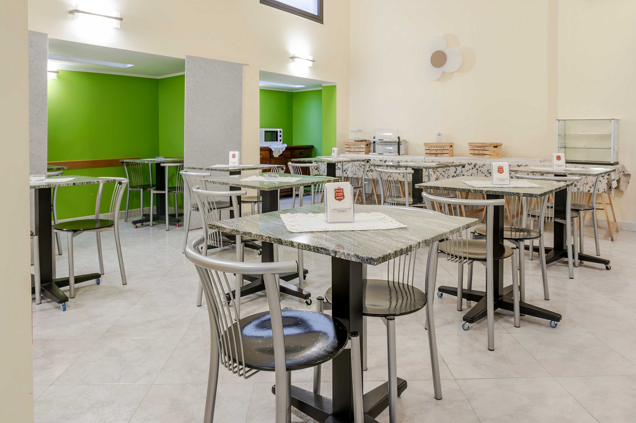 On the 2nd floor: (Living/bed room(Bed Linen, double bed, TV, air conditioning), bathroom(shower, toilet, shampoo))\n\nDesk, Elevator, Hot Water, Internet Access DSL, Safe, Wardrobe, First Aid, Beach, Play area, Breakfast room, electric kettle, coffee machine, microwave, fridge, balcony or terrace, heating, Essentials, Dedicated workspace, Cleaning Disinfection, Downtown, Enhanced cleaning practices, Near Ocean, Room-darkening shades, Town