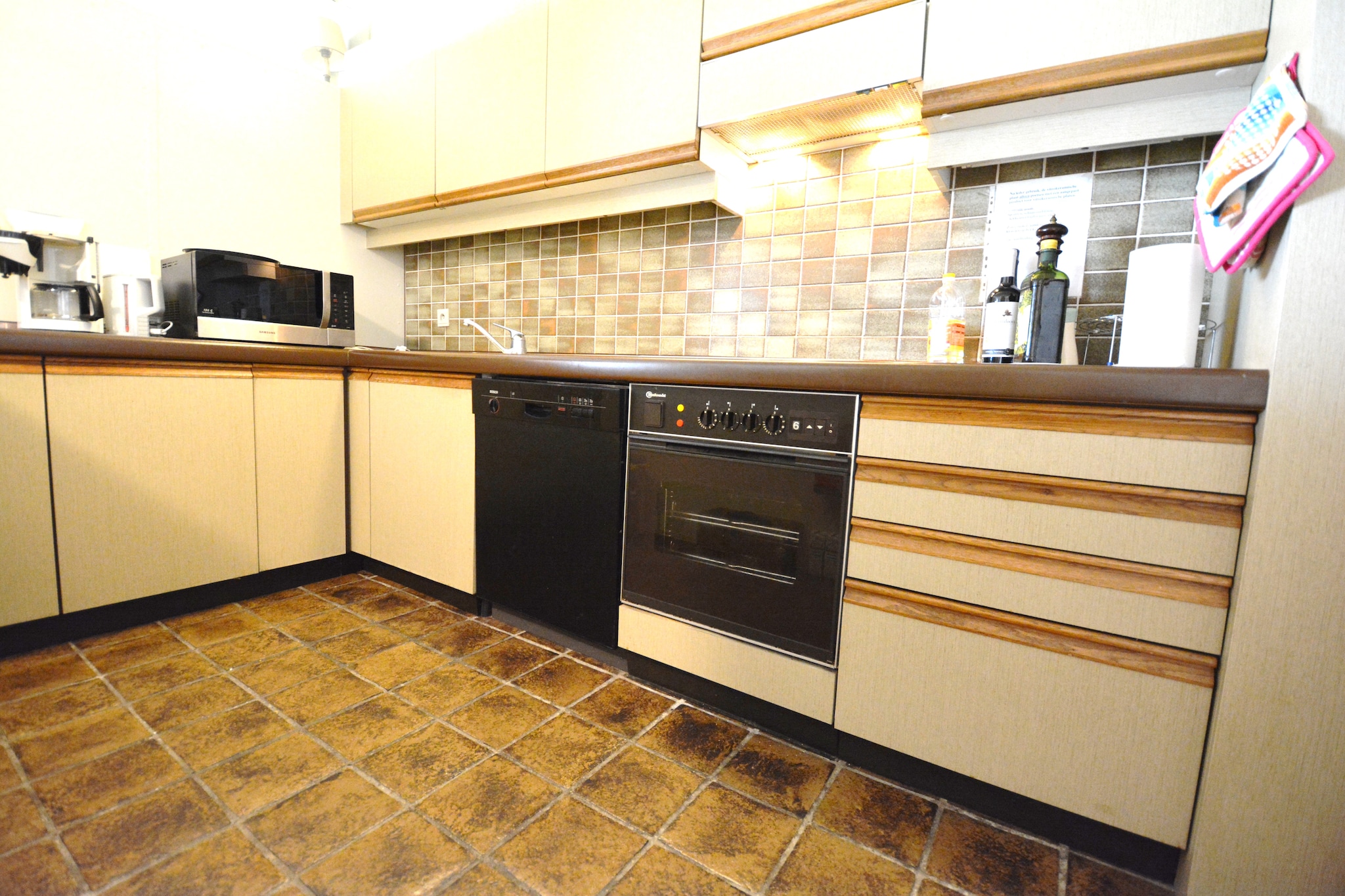 On the 3rd floor: (Living room(TV, dining table, seating area), Kitchen(oven, microwave, dishwasher), bedroom(double bed, washbasin), Bedroom with bathroom(double bed, bath tub, washbasin, washbasin, toilet), Bedroom with bathroom(double bed, shower, washbasin, toilet))\n\nwashing machine, bicycle storage, lift, ironing board, iron