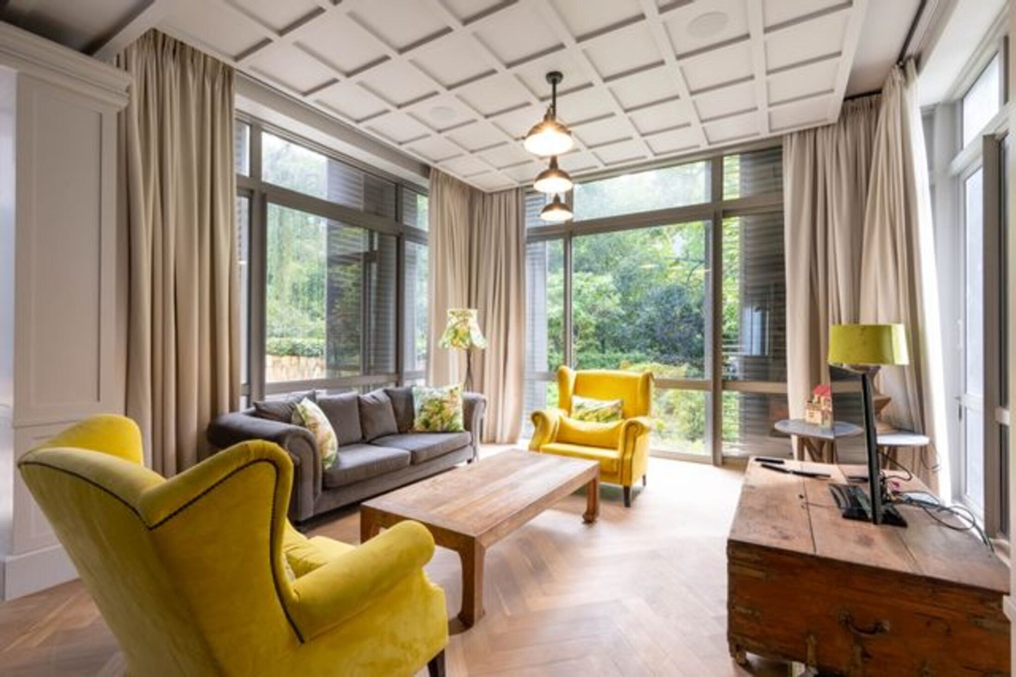 Step into a world of timeless charm at this exquisite French country house in the leafy, prestigious Bishopscourt. Designed by acclaimed architect Christiaan van Aswegen, the home blends rural tranquillity with refined sophistication. Soaring ceilings, sunlit spaces, and sweeping views of gardens, treetops, and mountains create an atmosphere of understated luxury.

The gourmet kitchen with its cooking island invites both culinary creativity and lively conversation, while formal living and dining rooms open onto serene garden views. Upstairs, the master suite features a copper bathtub under a chandelier, a double shower, and a spacious dressing room. Three further en-suite bedrooms two sharing a cosy pyjama lounge offer comfort and privacy for the whole family.

Outdoor living is equally enchanting, with a terrace, built-in barbecue, and swimming pool perfect for summer gatherings. A stepped garden and cricket net add a playful touch for families. Whether you’re enjoying a tranquil evening under the stars or hosting vibrant gatherings, this short-term rental offers a luxurious retreat in one of Cape Town’s most exclusive enclaves.
