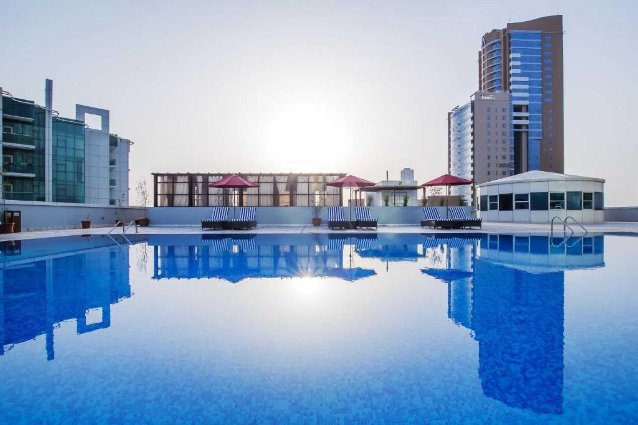Discover peaceful sophistication at Lux. Twin Stay, where comfort meets convenience in a central bayfront location. Perfect for families, business travelers, and leisure seekers, this stylish hotel offers a serene escape with exceptional amenities in the heart of Fujairah.

Top Highlights:
🏊 Two Rooftop Outdoor Pools – One for kids and one for all ages, open year-round.

🌐 Free High-Speed WiFi across the property.

🚗 Complimentary Private Parking with valet and EV charging available.

👨‍👩‍👧‍👦 Family-Friendly Rooms with inclusive, accessible features.

💆 On-Site Spa & Wellness Centre with sauna, steam room, and massage services.

🍽️ Two On-Site Restaurants serving international cuisine and kid-friendly meals.

✈️ Convenient Airport Shuttle service available.

💪 Modern Fitness Centre with classes and personal trainers.

🥐 Delicious Breakfast Options, including in-room service and special diet menus.

Elegant Room Features:
Relax in thoughtfully designed rooms featuring:

En-suite bathroom with shower, bath, bathrobes, and complimentary toiletries

Extra-long beds, wardrobe, and dressing space

City or bay views, flat-screen TV, electric kettle, mini fridge, and free WiFi

Perfect for Families:
Enjoy family time with:

Outdoor and indoor children’s play areas

Rooftop kids’ pool and playground

Table tennis and billiards (available at an extra charge)

Business & Services:
Business and comfort go hand-in-hand with:

Meeting and event facilities, business centre

24-hour reception, currency exchange, concierge service

Daily housekeeping, laundry, ironing, and dry-cleaning services

Wellness & Leisure:
Refresh and unwind with:

Full-service spa and wellness packages

Jacuzzi, steam room, sauna, sun loungers, and umbrellas

Fitness/spa locker rooms and expert wellness support

Accessibility for All:
Our facilities include:

Wheelchair-accessible rooms and amenities

Elevators and bathrooms with grab rails

Languages Spoken:
Arabic, English, Hindi, and Filipino