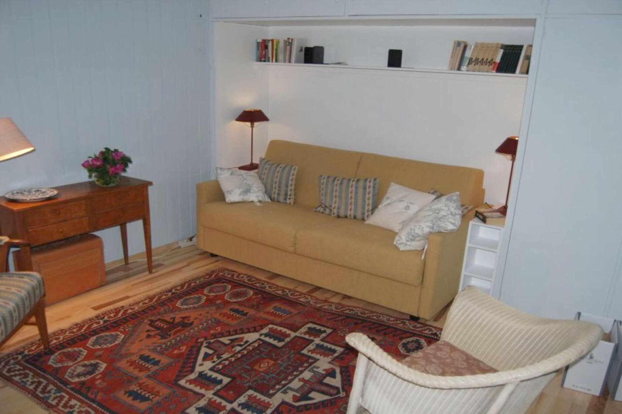 Ground floor: (hallway(Wardrobe Coatrack), open kitchen(dining table, electric kettle, cooker, coffee machine, microwave, dishwasher, fridge), Living/bed room(Games, Sofa, library, single sofa bed, TV, radio, stereo unit), Children\'s bedroom(double bed), bathroom(Mirror, toilet, shower, washbasin))\n\nSafe, First Aid, terrace(Sun Umbrella, Beach, garden furniture)