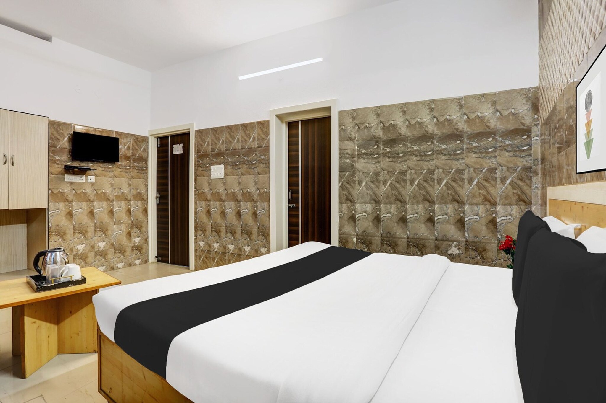 Comfortable Accommodations: Hotel O Jammu in Jammu offers family rooms with air-conditioning, private bathrooms, work desks, and free toiletries. Each room includes a seating area, TV, and wardrobe, ensuring a pleasant stay.

Dining Experience: The family-friendly restaurant serves Indian cuisine for lunch and dinner. Guests can enjoy a continental breakfast each morning. The on-site restaurant provides a relaxed ambience for meals.

Convenient Facilities: The hotel features a lounge, lift, 24-hour front desk, shared kitchen, laundry service, and room service. Free WiFi is available throughout the property, enhancing guest connectivity.

Prime Location: Located 5 km from Jammu Airport and 42 km from Vaishno Devi, the hotel is near J&K Bank and Jammu Tawi Station. Reception staff speak English and Hindi, assisting guests with their needs.

We’re sorry, but we are unable to accommodate unmarried couples at this property.
Guests with local ID proof are warmly welcome.
Apologies, but we are currently unable to host foreign nationals at this property.
Early Check-In Policy: A full day’s room rate will be charged for check-ins before 6:00 AM. Complimentary early check-in is available between 6:00 AM and 10:00 AM, subject to room availability.
Check-in is only available to guests aged 18 and above. Please provide a government-issued ID to confirm your age.
