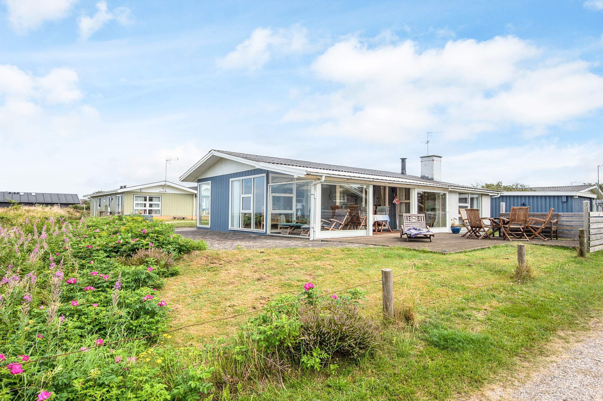 Kitchen(cooker(electric), coffee machine, dishwasher, fridge-freezer), Living/bed room(TV(danish TV channels (DR1 and TV2))), bedroom(double bed), bedroom(2x single bed), bathroom(washbasin, shower, toilet), heating(electric), terrace, garden furniture