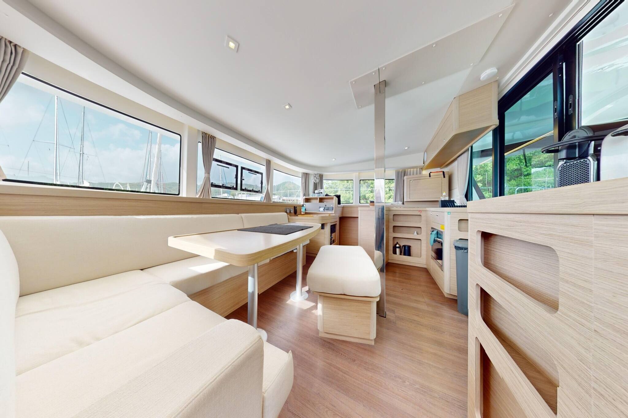 Step aboard your private, all-inclusive catamaran and embark on a luxurious sailing experience like no other. Guided by an experienced skipper and pampered by a dedicated hostess-cook, your days at sea are filled with gourmet meals, refreshing drinks, and breathtaking panoramas. This isn’t just a getaway—it’s a floating paradise offering 5-star comfort and total disconnection from everyday life.

This newest Lagoon model is where elegance meets innovation. With suspended steps, a wide aft platform, and a sun-drenched saloon, the catamaran is crafted for both beauty and function. The raised helm station ensures visibility and direct access to the sails, while the composite bimini and clever deck plan enhance safety and ease of navigation.

Inside, four double cabins offer hotel-like comfort with island beds, large windows, and ensuite bathrooms featuring separate showers. The "U" shaped kitchen opens to the cockpit, blending indoor and outdoor living with panoramic sea views. Every detail—from organic-inspired interiors to optimized rigging—has been thoughtfully designed for performance, serenity, and style.

Guests enjoy full access to all areas except the crew cabins. Book now to set sail on your dream escape—where freedom, elegance, and adventure await.
