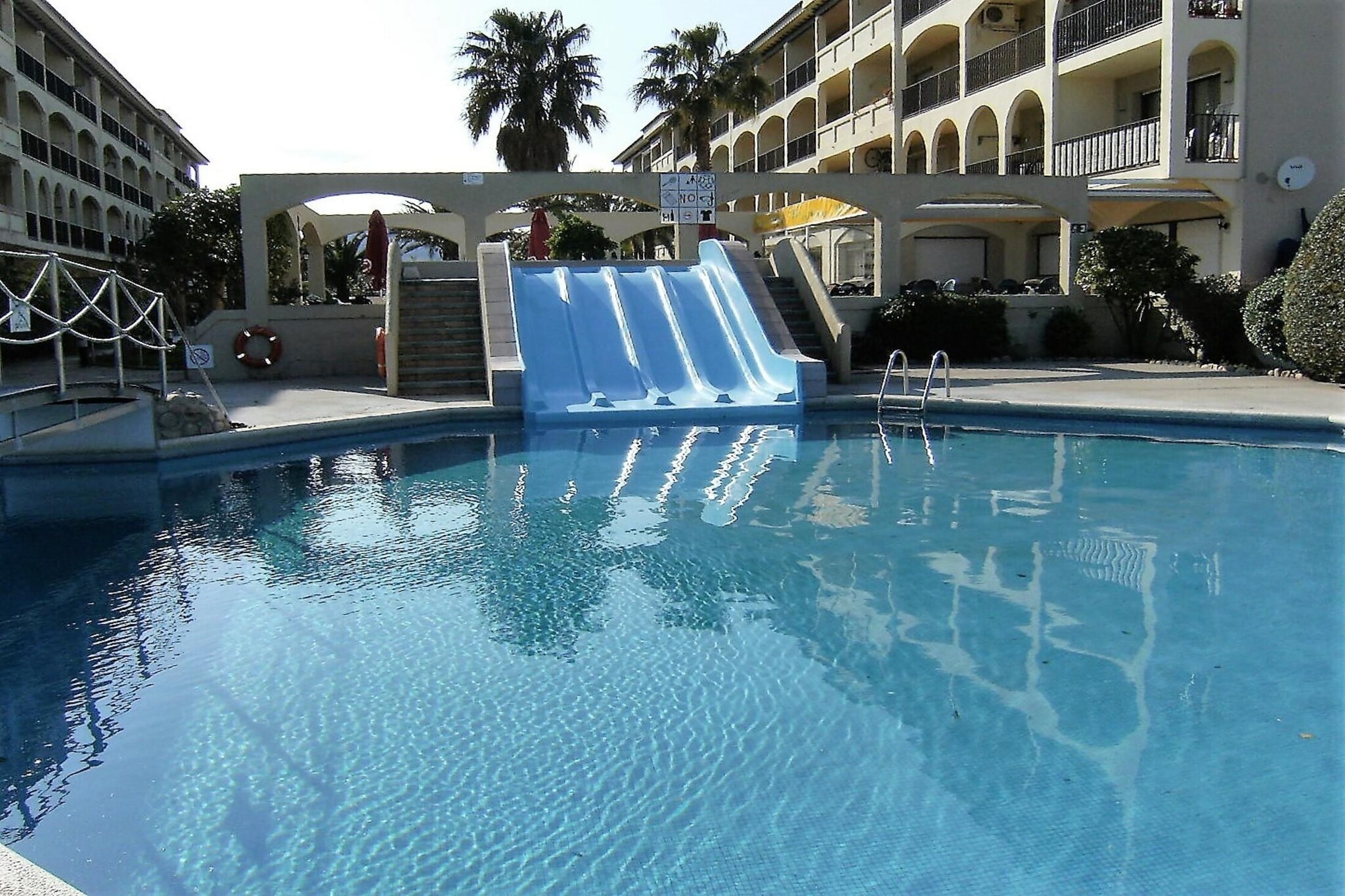 Elevator, Living room(single sofa bed, TV, dining table, seating area), open kitchen(toaster, coffee machine, oven, microwave, dishwasher, fridge-freezer, Juicer, dishes and cutlery), bedroom(single bed, single bed), bedroom(single bed, single bed), bathroom(shower), Children pool, washing machine, air conditioning, terrace, swimming pool, iron, air to air heatpump