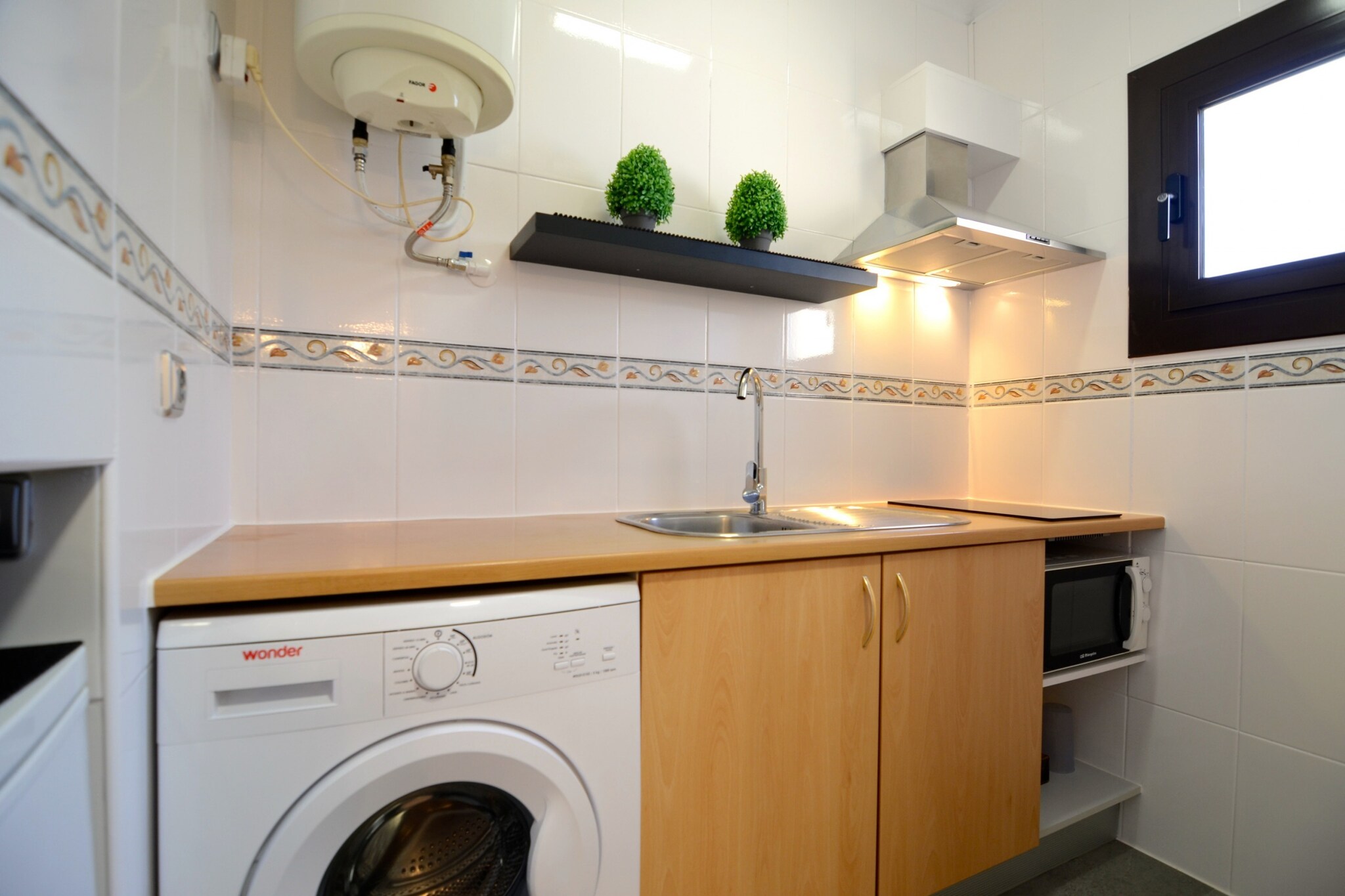 On the 3rd floor: (Living room(double sofa bed, TV, dining table), Kitchen(toaster, coffee machine, microwave, fridge, washing machine, dishes and cutlery), bedroom(double bed), bathroom(shower))\n\nwashing machine, heating(electric), terrace, iron