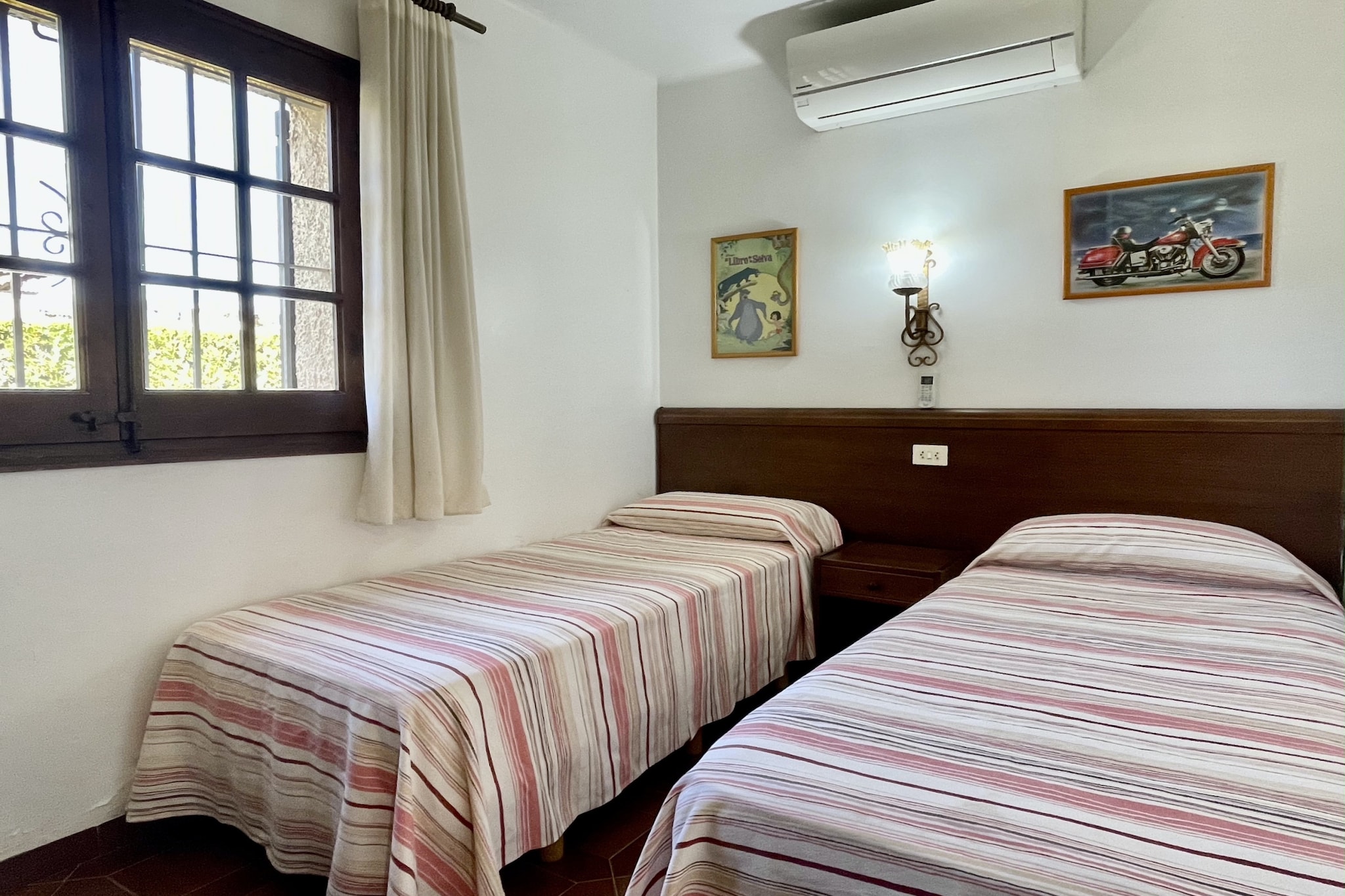 Ground floor: (Living room(TV, dining table, seating area), open kitchen(toaster, toaster, coffee machine, oven, microwave, dishwasher, fridge-freezer, Juicer, dishes and cutlery), bedroom(double bed), bedroom(single bed), bedroom(single bed, single bed, single bed), bathroom(bath tub), toilet(toilet))\n\nChildren pool, Garden Furniture , washing machine, air conditioning, terrace, garden, BBQ, parking, swimming pool, iron, air to air heatpump