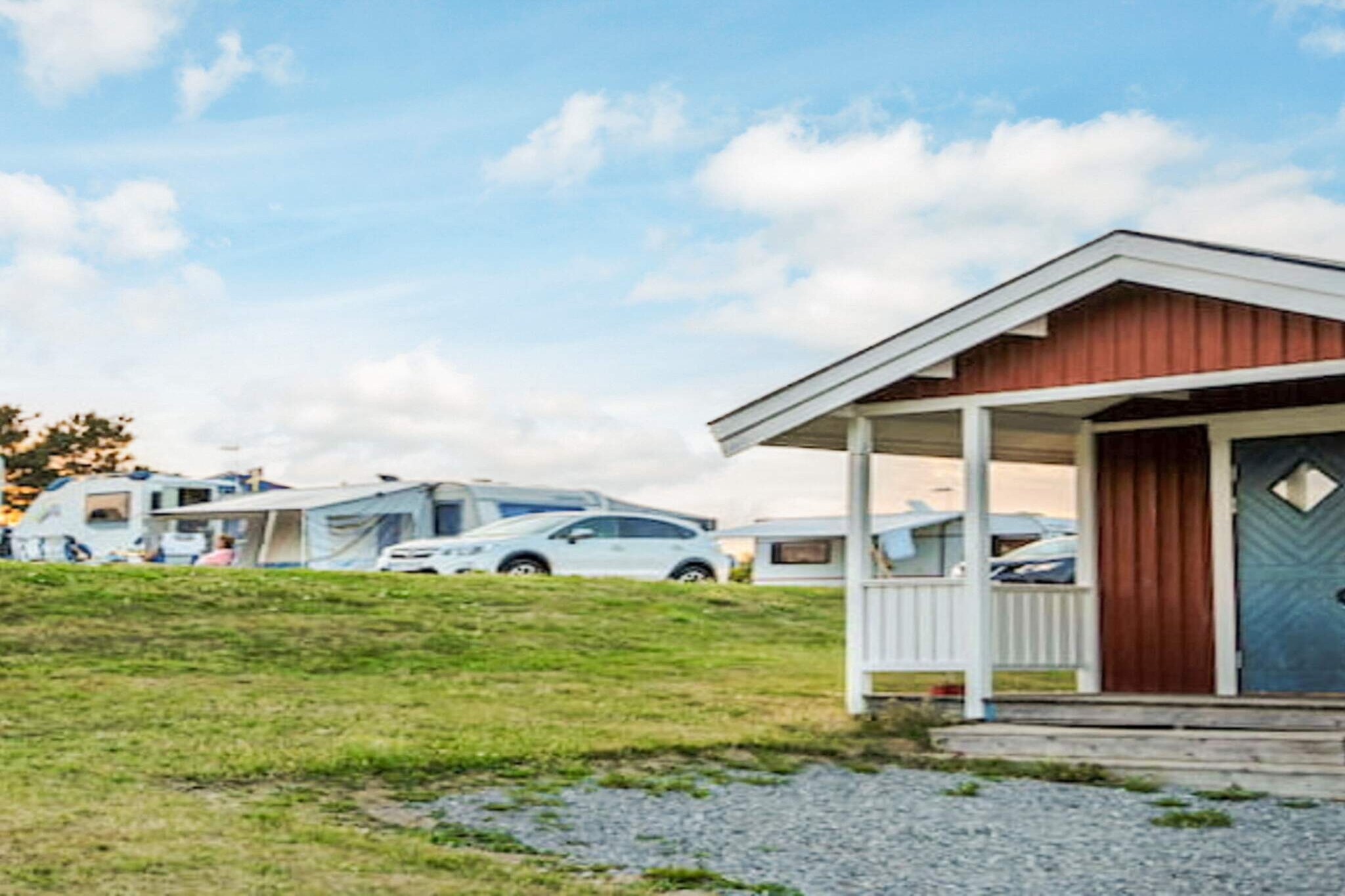 Kitchen(coffee machine, fridge-freezer), Living/bed room(TV), bedroom(double bed), bedroom(2x single bed, single folding bed), bedroom(2x single bed), bathroom(washbasin, shower, toilet), game computer, heating(central), terrace, terrace, garden furniture, BBQ, parking, play equipment