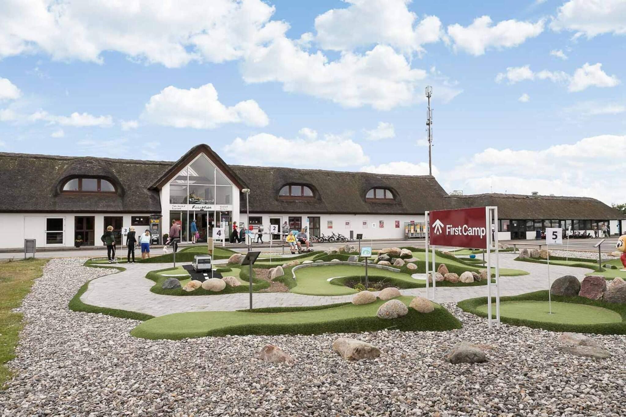 First Camp Klim Strand – Northwest Coast is the ultimate destination for families, offering a blend of relaxation, adventure, and wellness, all set in a beautiful coastal environment. This child-friendly campsite welcomes guests of all ages with a variety of accommodations, including caravans, motorhomes, cabins, and beach huts. Whether you're looking for thrilling activities or a peaceful escape, the campsite's fantastic amenities, including an indoor water park, wellness facilities, and a bistro, ensure an unforgettable stay for everyone. Child-friendly – The campsite is designed for families, with activities and facilities that cater to all ages, making it an ideal choice for a family getaway. Variety of accommodations – Choose from a wide range of accommodations, from beach huts and camping cabins to mobile homes for a more luxurious experience. Indoor water park – Free access to the water park is included, offering endless fun with slides, pools, and play areas for all ages. Indoor playland – The playland provides a safe and fun space for kids to enjoy various activities, rain or sunshine. Wellness – Unwind in the sauna, steam room, or rustic wooden tubs. Enjoy the soothing warmth, eucalyptus-scented steam, and invigorating cold bucket splashes. The hot tub with massage jets offers the perfect way to relieve muscle tension. Bistro and food options – The campsite’s bistro serves delicious meals for both young and old, offering a welcoming dining experience. The restaurant also caters to the campsite's conference room. Conference and event space – For those on business or attending events, the campsite offers a spacious conference room upstairs in the reception building. Fantastic location – Situated on Denmark’s northwest coast, the campsite offers the perfect balance of outdoor adventure and relaxation in a scenic environment. Whether you're after outdoor adventures, cozy relaxation, or quality family time, First Camp Klim Strand has everything you need for the perfect holiday.