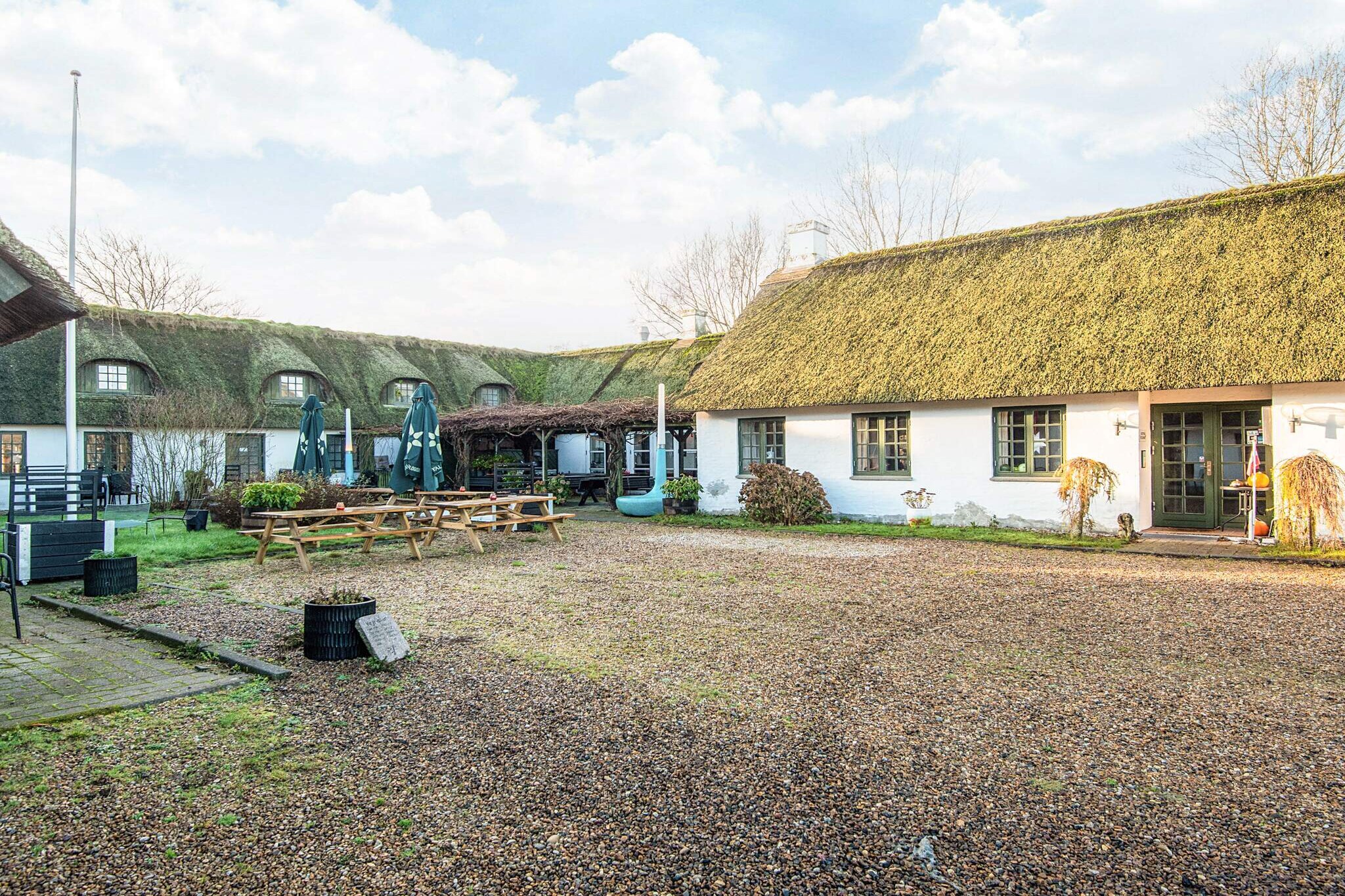 This charming hotel, located in the picturesque Fanø, South West Jutland, Denmark, offers a peaceful retreat for those seeking a relaxing holiday. Situated near the coast, the hotel provides a cozy, welcoming atmosphere with modern amenities and a beautiful setting. Guests can enjoy a variety of outdoor activities, including walks along the beach and nearby nature reserves, all while staying in a well-maintained property that combines comfort with scenic views. Also, you get a free access to water park! The hotel is ideally located for those looking to explore the surrounding area. Attractions such as Legoland, Givskud Zoo, and the Tirpitz Museum are within reach, providing fun and cultural experiences for visitors of all ages. Additionally, the nearby Universe Science Park and Esbjerg Museum offer unique opportunities to enjoy both nature and history, making it an ideal destination for families and adventure seekers alike. The hotel offers three types of rooms to cater to different needs and preferences. The Premium Suite is perfect for couples, featuring a cozy living room with a fireplace, a double bed, and bathroom. The Double Room offers a more intimate setting, with a double bed and TV, and bathroom. Finally, the Suite provides a comfortable space with a living room and a double bed, and bathroom facilities. All rooms include outdoor seating areas with garden furniture and terraces, offering guests a relaxing space to unwind after a day of exploration.