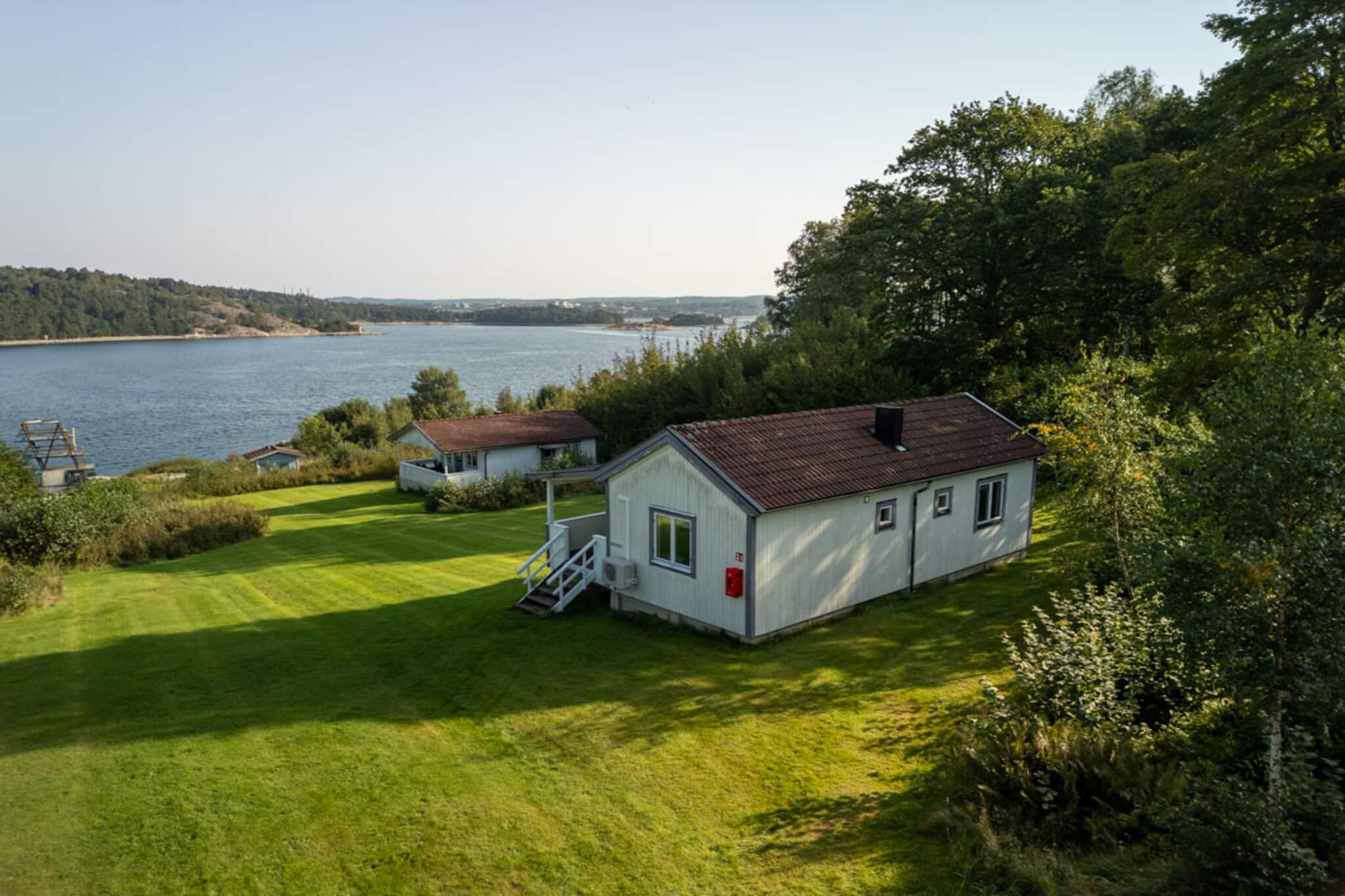 Kitchen(cooker(2 ring stoves, gas), coffee machine, microwave, dishwasher, fridge(+ freezer)), Living/bed room(double folding bed), bedroom(2x single bed), bedroom(2x bunk bed), heating(electric), parking