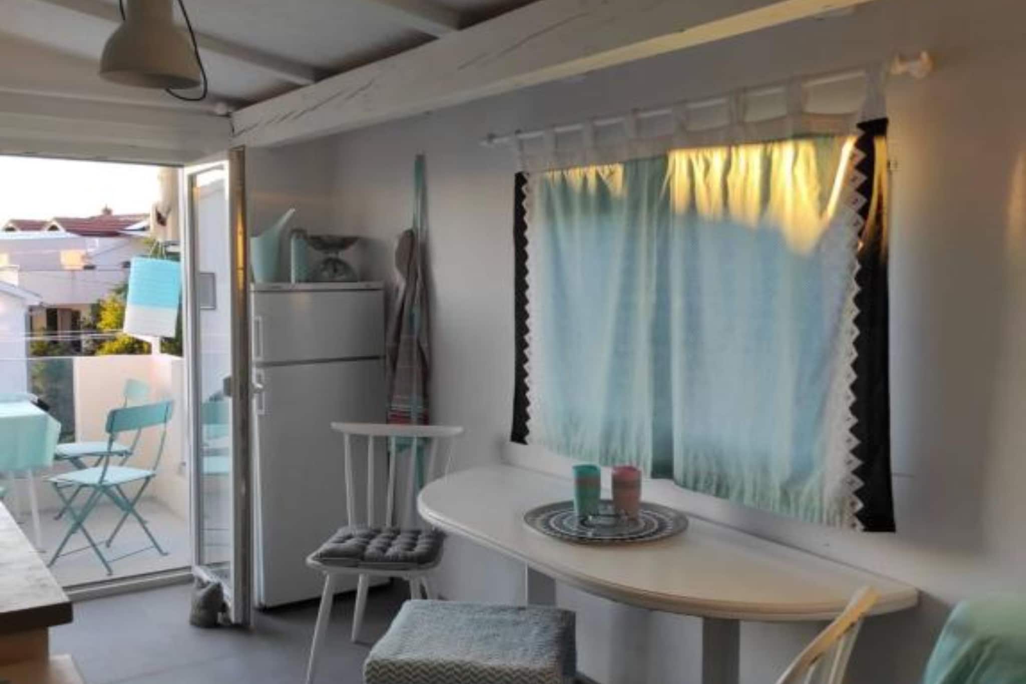 Modern Beachfront Apartments – Srima, Šibenik, Croatia, are located in the tranquil village of Srima near Šibenik. These modern beachfront apartments offer stylish living right by the Adriatic Sea. They feature contemporary design, sea-view terraces, air conditioning, fully equipped kitchens, and private parking. Ideal for both vacation stays, these properties are steps from the beach and close to national parks and historic Šibenik.

Note:
Private parking is available, and a reservation is not required.
A Baby cot is available on request.
Wi-Fi is available throughout the property.
Pets are allowed with notice.
The property has boat moorings. Please get in touch with the property owner in advance for further details.
The property accepts small pets. Additional charge is €5.00 per day

This one-bedroom can accommodate up to four guests. It features an SAT/flat-screen TV and is combined with a living room seating area and kitchen. The private bathroom is equipped with a shower and toilet.

Thanks to its excellent location, everything you'll need for your vacation is just a short walk from the property. Grocery stores, cafes, restaurants—everything is within a 2.00 km radius. The beach is 20 m away from the property.

The airport is 55 km away from the property.