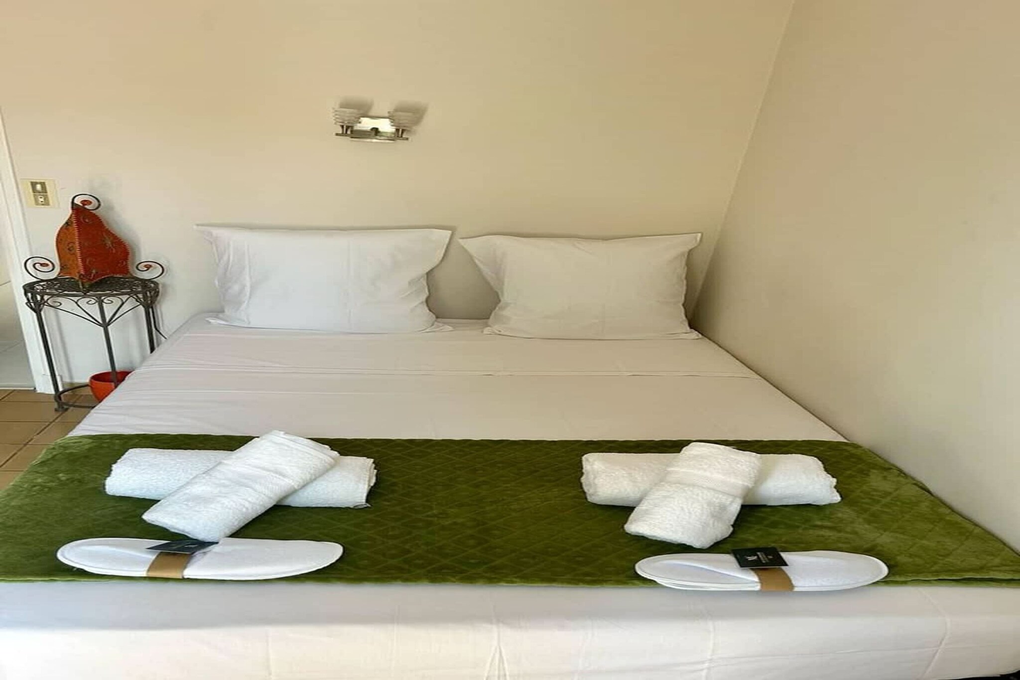 On the 1st floor: (open kitchen(stove, electric kettle, toaster, coffee machine, oven, microwave, dishwasher, fridge-freezer, dishes and cutlery, Cooking basics), Living/diningroom(2x single sofa bed, TV, dining table, fireplace, seating area), bedroom(double bed), bedroom(double bed), bathroom(shower), toilet)\n\nBed Linen, Game Console, Hot Water, Wardrobe, Internet access, First Aid, baby bath, washing machine, balcony or terrace, heating, garden, BBQ, changing mat, high chair, iron, crib(free), shampoo, Essentials, Dedicated workspace, Baby monitor, Extra pillows and blankets