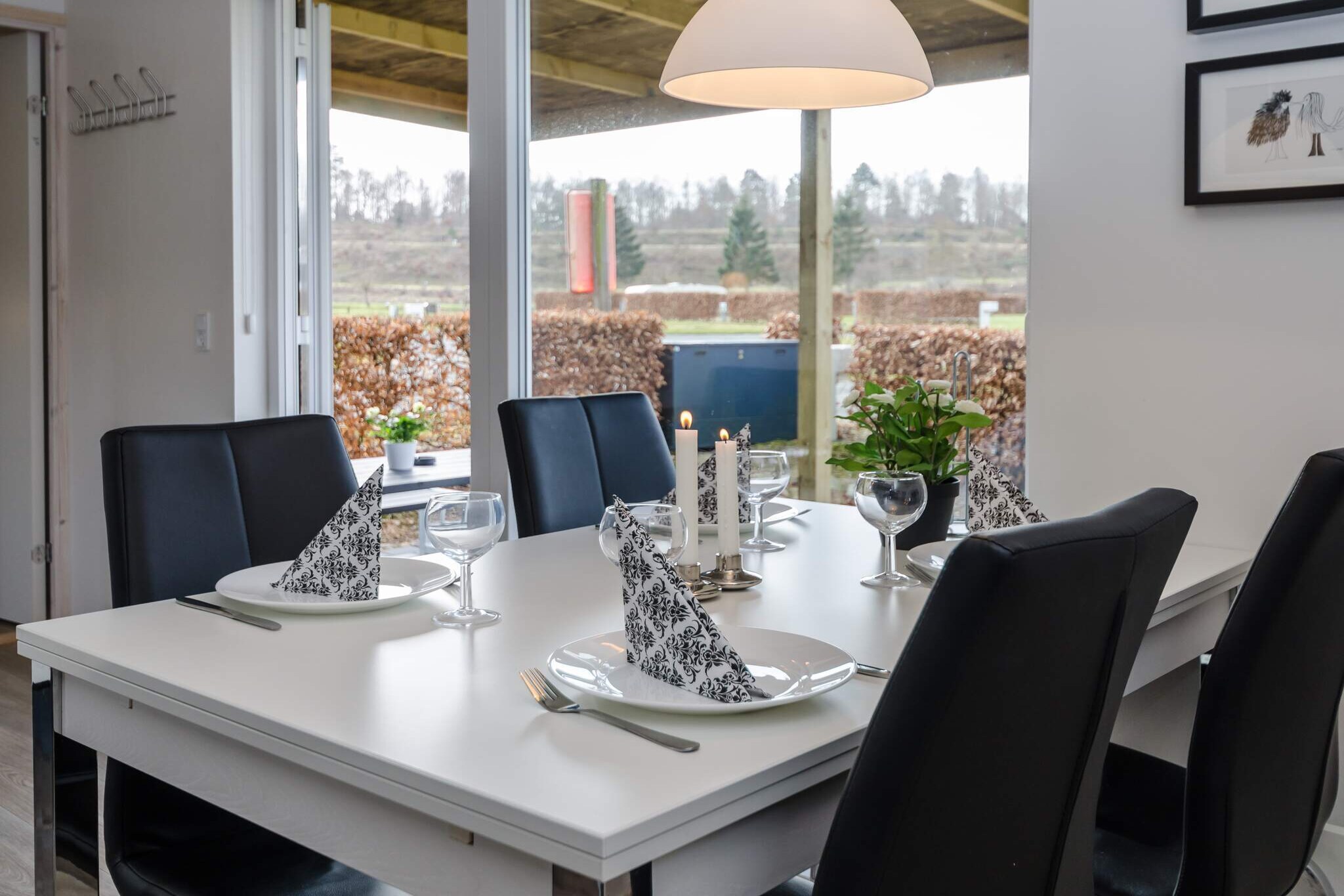 Kitchen(cooker(electric), coffee machine, fridge(+ freezer)), Living/bed room(single folding bed, TV), bedroom(double bed), bedroom(2x bunk bed), bathroom(washbasin, shower, toilet), heating(central), terrace, garden furniture, sun loungers, parking, play equipment