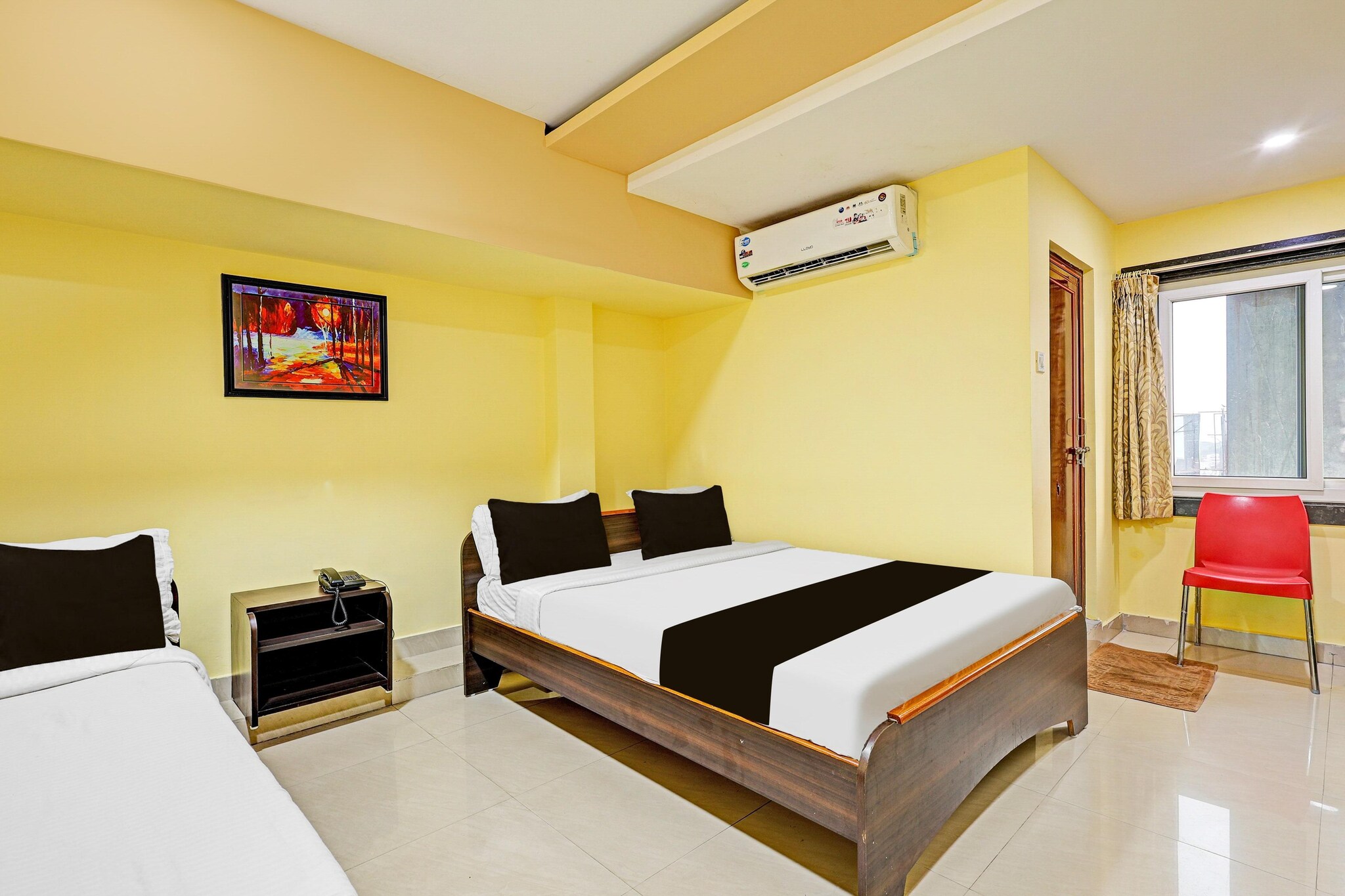 Comfortable Accommodations: Super Collection O NAD Near Airport in Visakhapatnam offers family rooms with air-conditioning, private bathrooms, work desks, and free WiFi. Each room includes a TV, wardrobe, and tiled floors.

Convenient Facilities: Guests enjoy a lounge, lift, 24-hour front desk, housekeeping, laundry, room service, meeting rooms, and luggage storage. Free on-site parking is available.

Dining Options: A continental breakfast is served daily.

Local Attractions: Located 4 km from Visakhapatnam Airport, the hotel is near attractions such as Indira Gandhi Zoological Park (17 km), Dondaparithy and Daba Gardens (8 km each), and Kailasagiri Train Station (16 km).

Unmarried couples are warmly welcome at this property.
Guests with local ID proof are warmly welcome.
Early Check-In Policy: A full dayâ€™s room rate will be charged for check-ins before 6:00 AM. Complimentary early check-in is available between 6:00 AM and 10:00 AM, subject to room availability.
Check-in is only available to guests aged 18 and above. Please provide a government-issued ID to confirmÂ yourÂ age.
