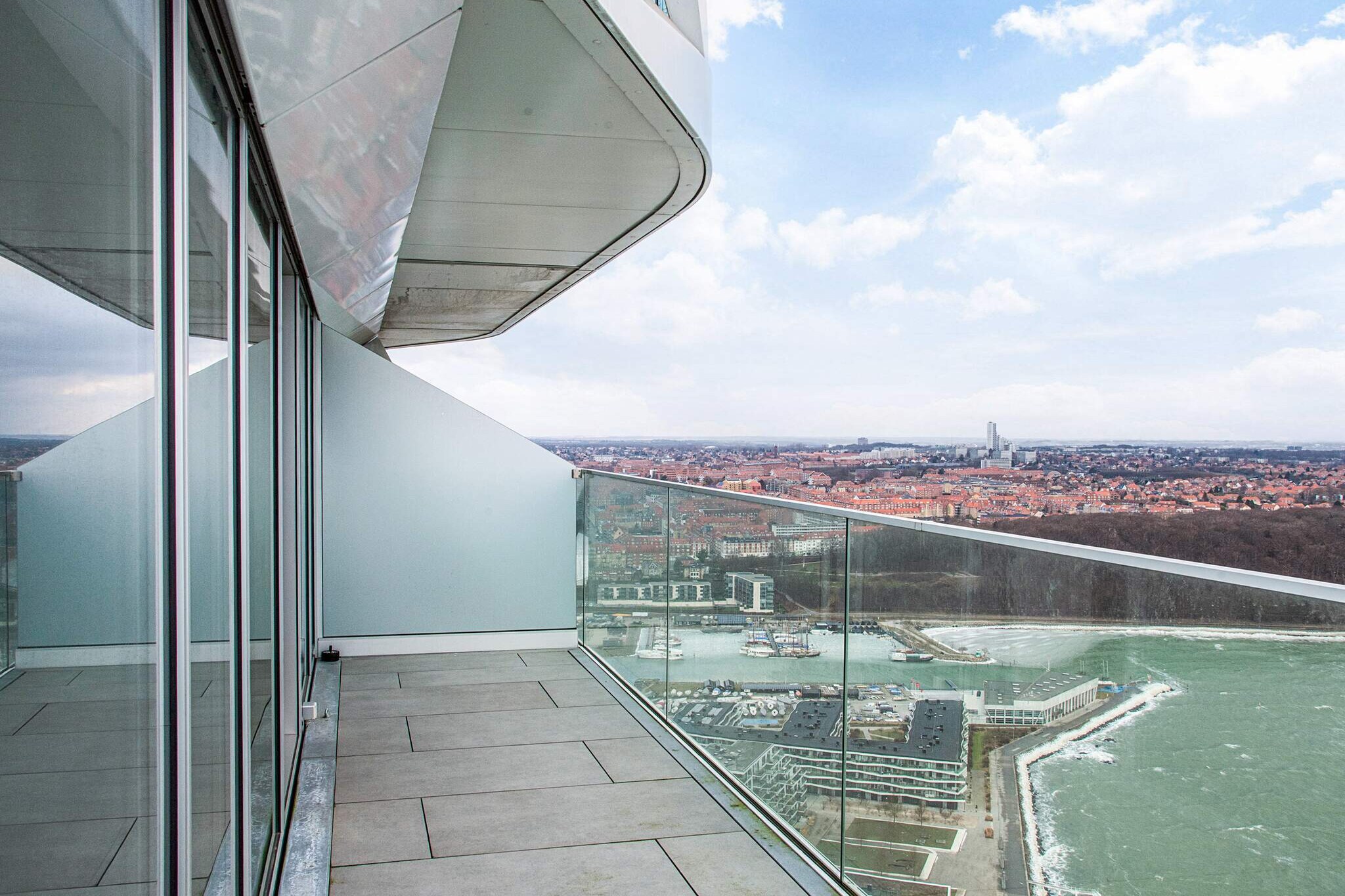 Exclusive luxury apartment on the 42nd floor of Lighthouse Experience a stay in an absolutely unique class in this elegant luxury apartment in Lighthouse – Denmark's highest residential building. The apartment is located 130 meters above sea level , only 10 meters from the water's edge , and on the 42nd floor with a unique 310 degree panoramic view of Aarhus, the bay and the surrounding landscape. The apartment is furnished with a stylish and exclusive expression, where carefully selected materials, complete details and high comfort come together in a higher unity. The modern, fully equipped kitchen invites you to leisurely dining experiences, while the elegant living rooms create the perfect setting for relaxation. The large windows provide beautiful, natural light and let the view be an integral part of the experience. The two private balconies extend the home and provide the opportunity to enjoy your morning coffee in silence or a glass of wine in the evening – with the sea and city lights as a backdrop. The apartment is located on attractive Aarhus Ø, just a few minutes from the city center. Aarhus offers a rich cultural life with attractions such as ARoS Art Museum , Den Gamle By , Moesgaard Museum , Aarhus Cathedral and the atmospheric Latin Quarter with cafes and restaurants. For those of you who also want nature experiences, Mols Bjerge National Park and Kalø Castle Ruins are within a short driving distance. A stay for the discerning guest who seeks uncompromising luxury, tranquility and one of Denmark's most spectacular.A refundable deposit might be charged closer to your check-in date. The security deposit ensures a smooth stay and covers any additional services or consumption charges.This deposit covers utilities consumed during your stay and any additional services that may be taken.The final amount will be adjusted based on actual meter readings, actual usage of extra services, and any remaining balance will be refunded within 21 days after checkout.This deposit simply acts as a prepayment for charges that you would anyways pay for, ensuring a seamless stay and check-out experience.