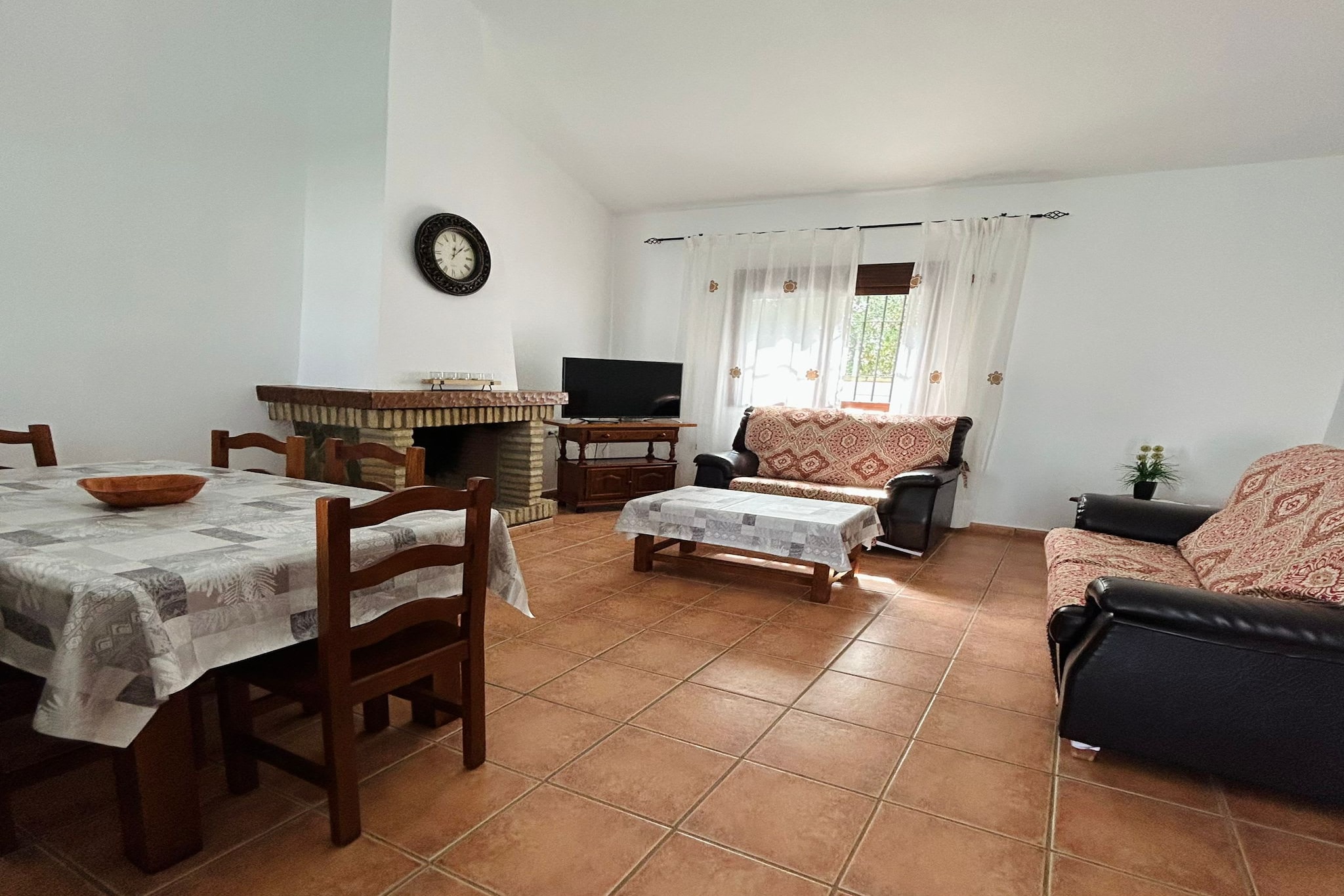 Tucked away in the quiet countryside of Conil de la Frontera, this charming rural house offers the perfect escape for those who love comfort without losing touch with authentic Andalusian life. With room for up to six guests, it’s a home that feels both relaxed and welcoming, designed for simple pleasures—sharing meals, cooling off in the pool, and enjoying the slow rhythm of village life.

Inside, the atmosphere is cozy and uncomplicated. The living area invites you to unwind with a good book by the fireplace or gather around the table for long dinners that stretch into conversation. The kitchen is well equipped—dishwasher, oven, coffee machine, and more—so cooking feels easy, whether it’s a quick breakfast before heading to the beach or a barbecue feast to enjoy outdoors. Each of the three bedrooms is fitted with air conditioning and mosquito screens to guarantee a good night’s sleep: one with a double bed, and two with twin beds. A bright bathroom, plus small details like a washing machine and hairdryer, ensure your stay feels complete.

Step outside and the Andalusian charm truly comes alive. A spacious terrace with a barbecue overlooks the surrounding countryside, while the private pool glimmers in the sun, waiting for lazy afternoons and refreshing swims. The setting is peaceful yet close to everything—just a short walk into Conil’s lively town center and a quick drive to the golden beaches that have made this coastline so loved.

This house isn’t about luxury or pretense—it’s about comfort, privacy, and the feeling of having your own corner of Conil to enjoy at your own pace.