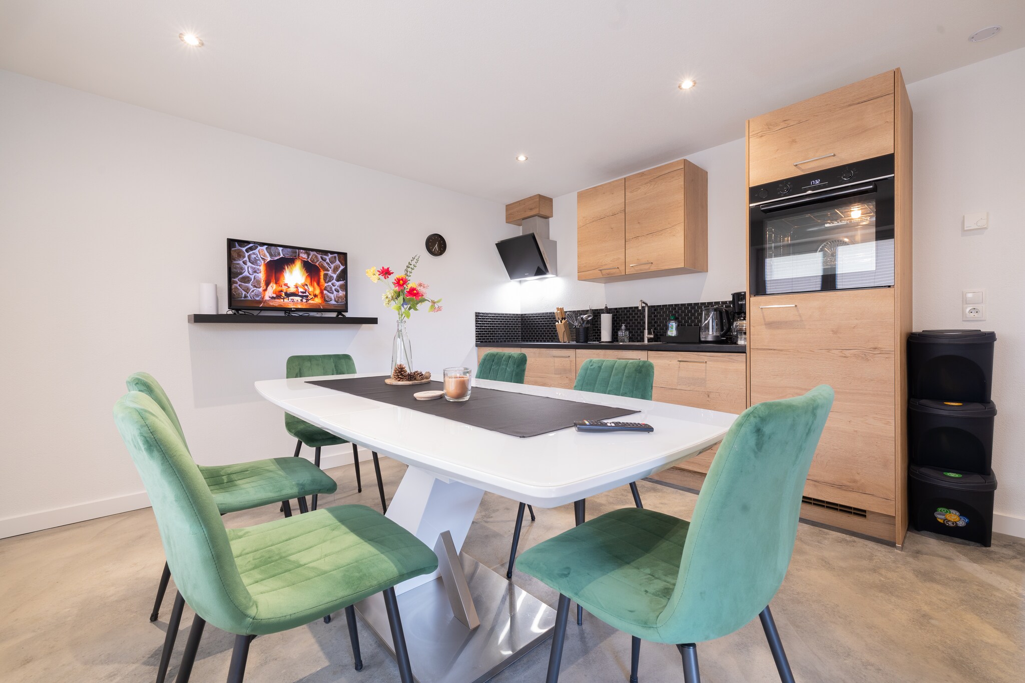 open kitchen(hob, electric kettle, coffee machine, oven, dishwasher, fridge, freezer, dishes and cutlery), Living/diningroom(TV, dining table), bedroom(double bed), bedroom(double bed), bedroom(bunk bed), bathroom(shower, hairdryer), toilet, Internet access, balcony, parking