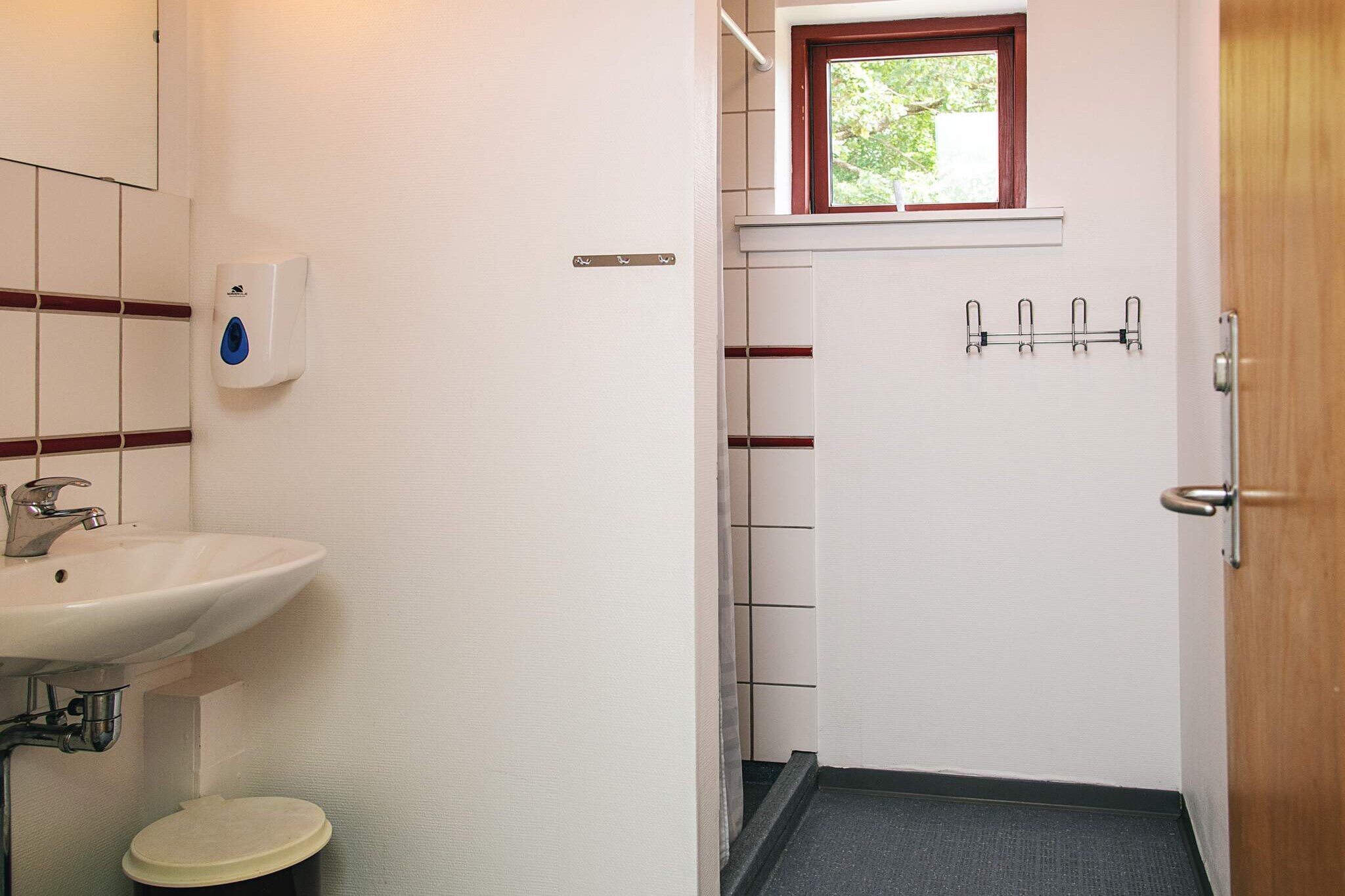 Living room(TV(danish TV channels (DR1 and TV2)), children\'s bed), Kitchen(cooker(2 ring stoves), coffee machine, fridge), bedroom(double bed), bedroom(2x bunk bed), bathroom, mezzanine(double bed), heating(central), terrace, garden furniture, sun loungers, parking, play equipment, table tennis table