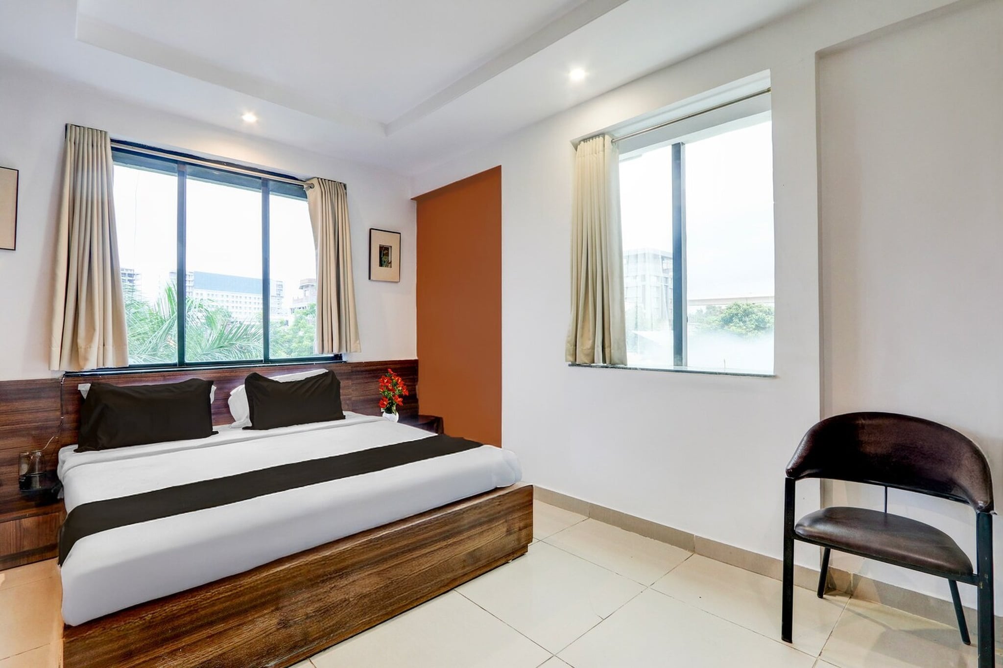 Super Townhouse Nagpur Airport Formerly Flora Inn is situated in Dhantoli, within 7 km of Vidarbha Cricket Association Stadium and 3.6 km of Deekshabhoomi. Featuring a shared lounge, the 3-star hotel has air-conditioned rooms with free WiFi, each with a private bathroom. The accommodation features room service, a 24-hour front desk and luggage storage for guests.

At the hotel, rooms are equipped with a desk. The rooms at Super Townhouse Nagpur Airport Formerly Flora Inn are fitted with a seating area and a flat-screen TV with satellite channels.

Ramakrishna Ashram is 3.9 km from the accommodation, while Ambazari Lake is 4.8 km from the property. Dr. Babasaheb Ambedkar International Airport is 1 km away.

1. Unmarried couples are warmly welcome at this property.
2. Guests with local ID proof are warmly welcome.
3.Early Check-In Policy: A full dayâ€™s room rate will be charged for check-ins before 6:00 AM. Complimentary early check-in is available between 6:00 AM and 10:00 AM, subject to room availability.
4.Foreign guests are welcome and allowed to stay at this property without any restrictions
Check-in is only available to guests aged 18 and above. Please provide a government-issued ID to confirmÂ yourÂ age.

